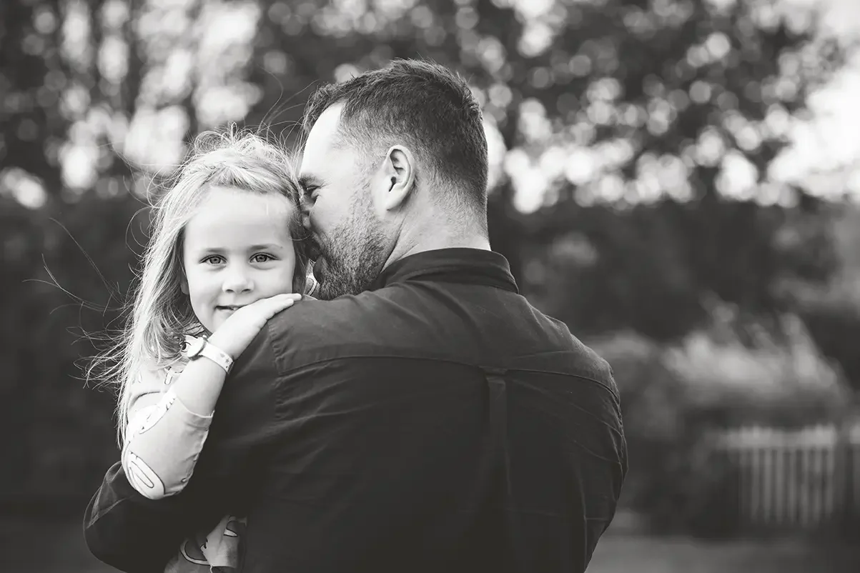 Father and daughter during a family photoshoot in East Harptree, Somerset.