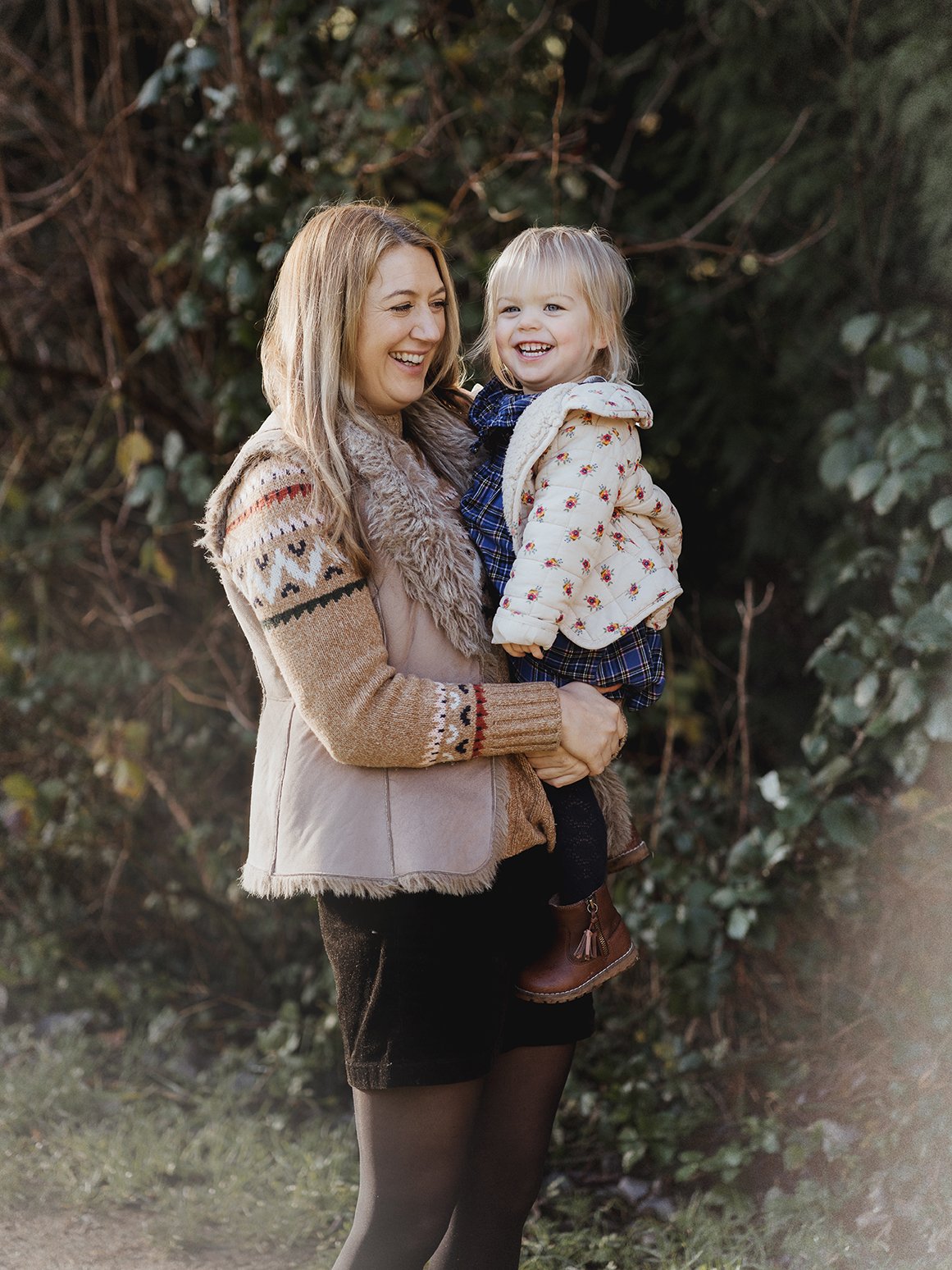 Mum and daughter laughing during a family photoshoot in Bath