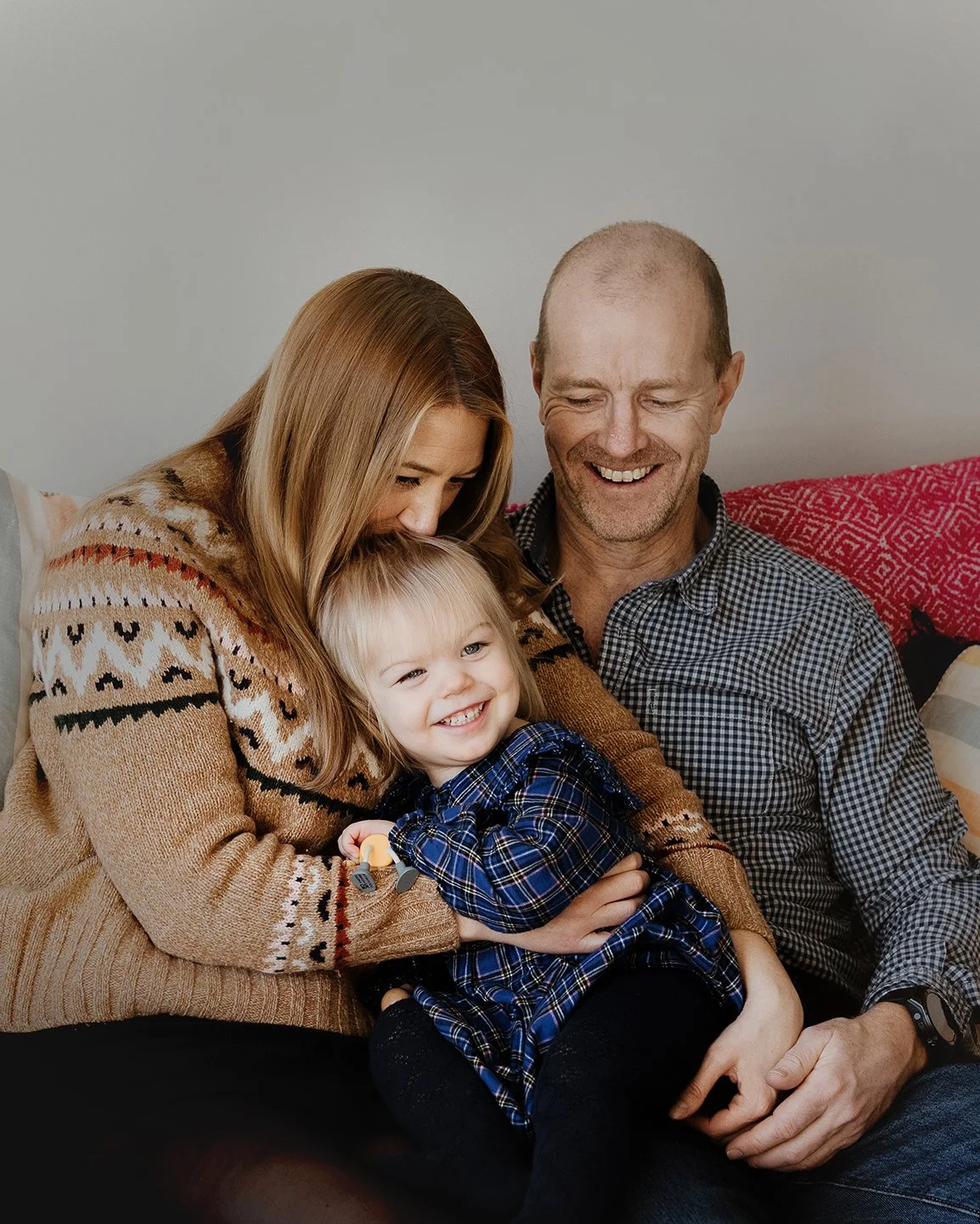 Two year old with her mum and dad during a relaxed photoshoot in Bath