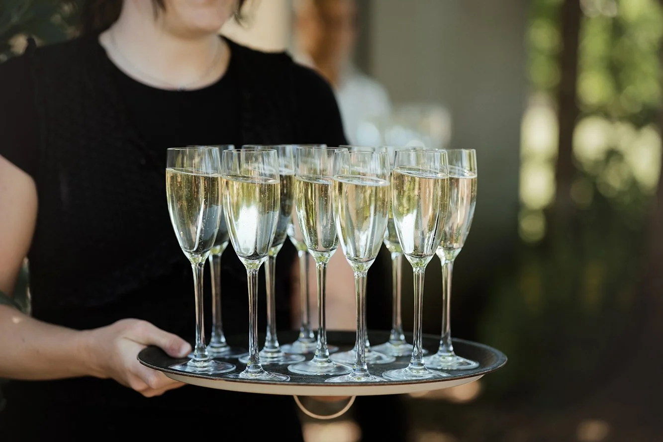 Bristol wedding photographer - image of glasses of champagne for wedding guests at Old Down Estate near Bristol.