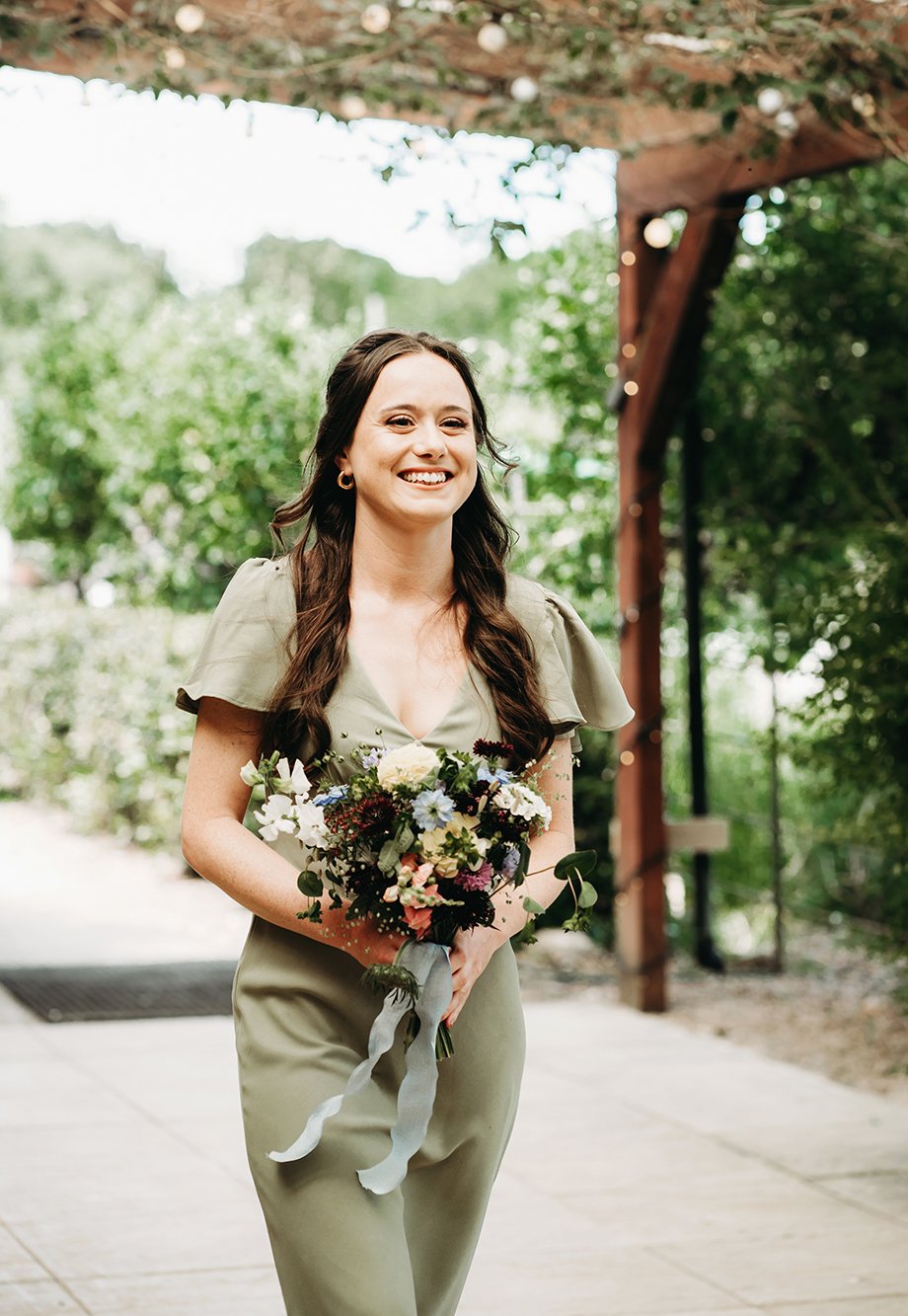 Image of a bridemaid walking down the aisle.