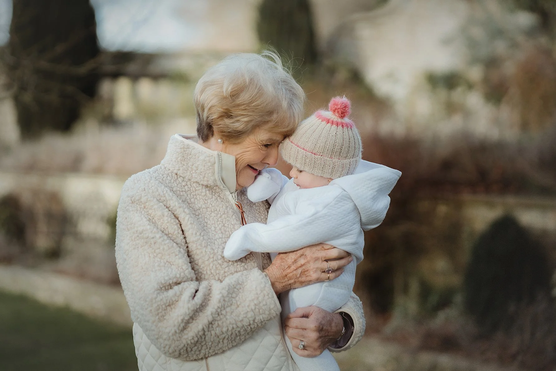 Image of grandmother with granddaughter during a family photoshoot.
