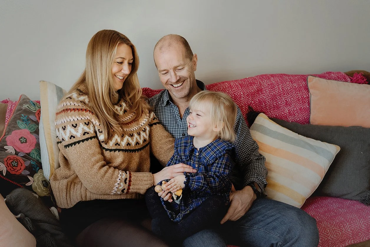 Two year old with her mum and dad during a relaxed photoshoot in Bath