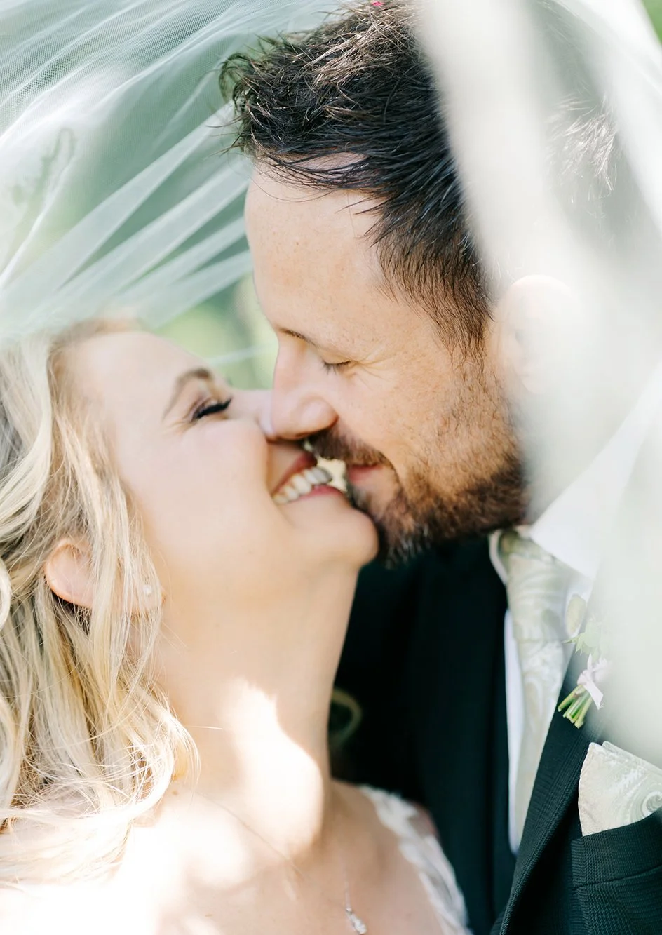 Wedding couple kissing on their wedding day at Old Down Estate near Bristol