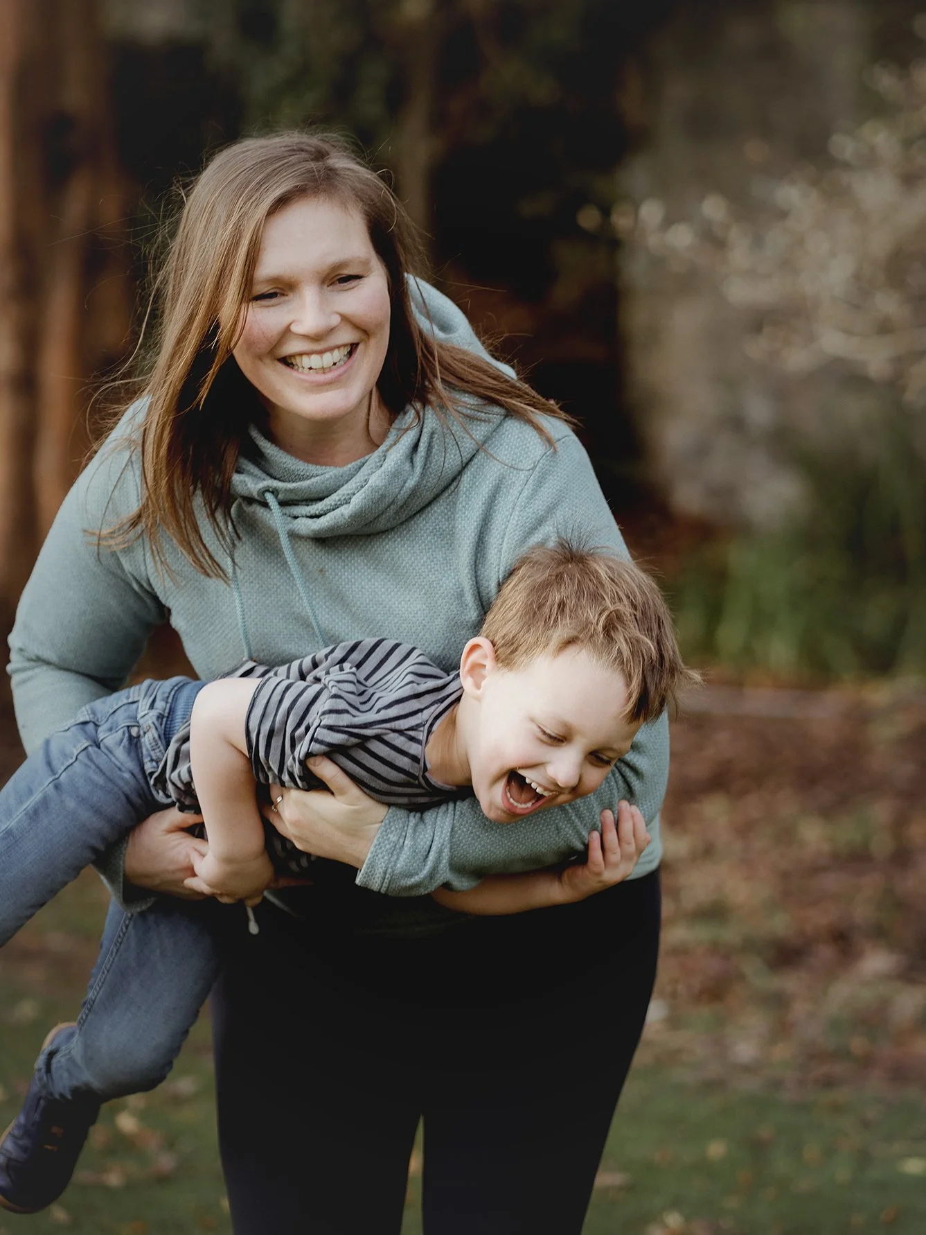 Family photographer Bristol - image of a mother playing with her young son during a family photoshoot in Bristol.