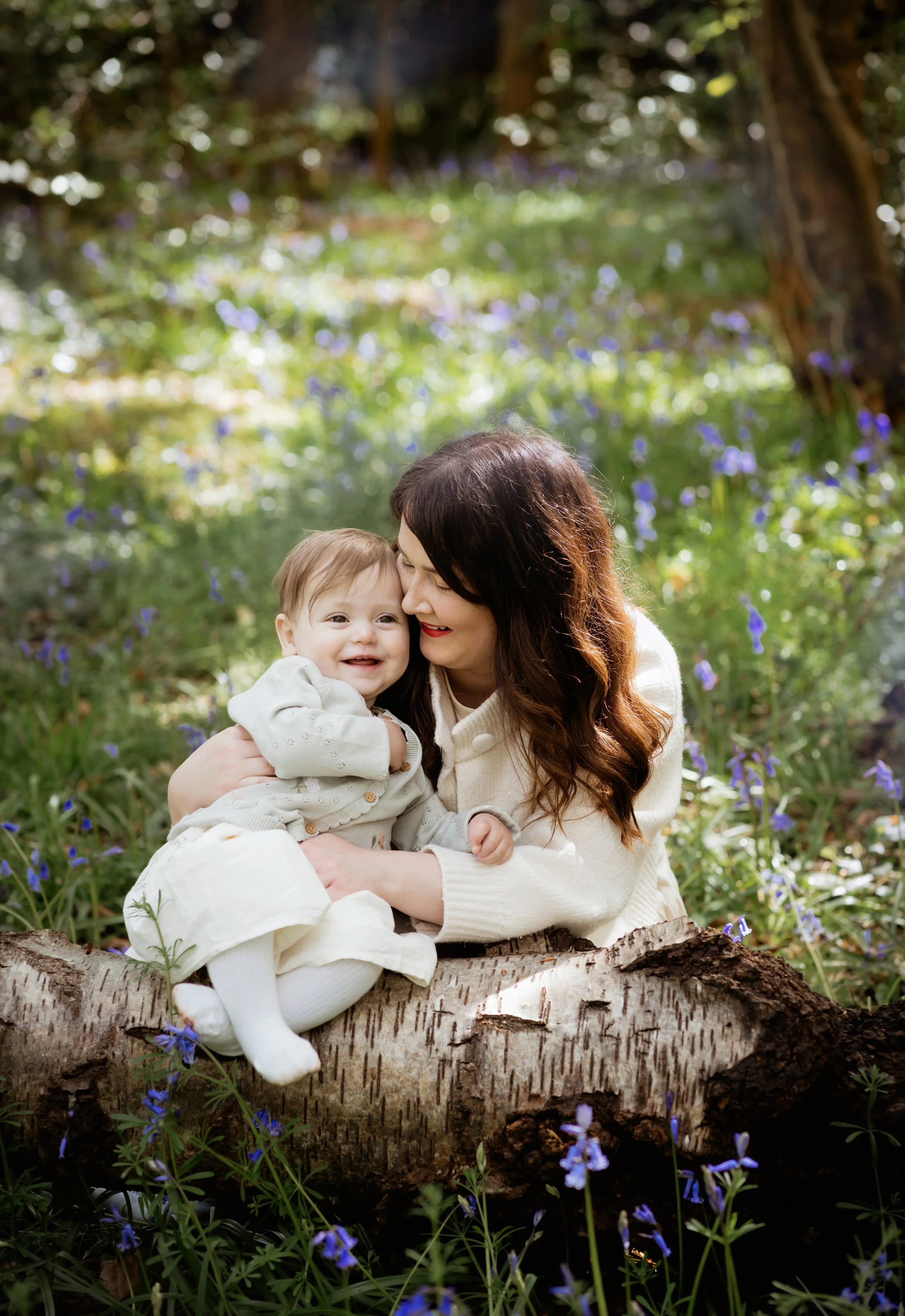 Family photographer Bristol - Mother and daughter during a family photoshoot in the bluebells at Ashton Court.