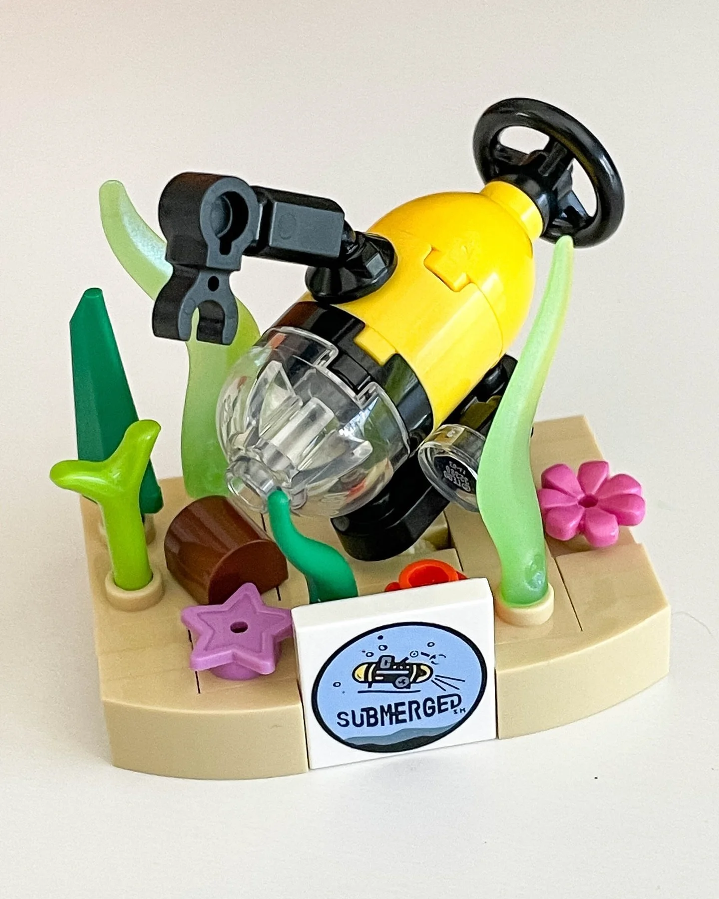 FLL Submerged Model

My team is finishing their First LEGO League Explore season tomorrow, and I made a quick trophy for them to celebrate the season. Loosely based on the tile this year. This is our second year in FLL. Admittedly also the last seaso