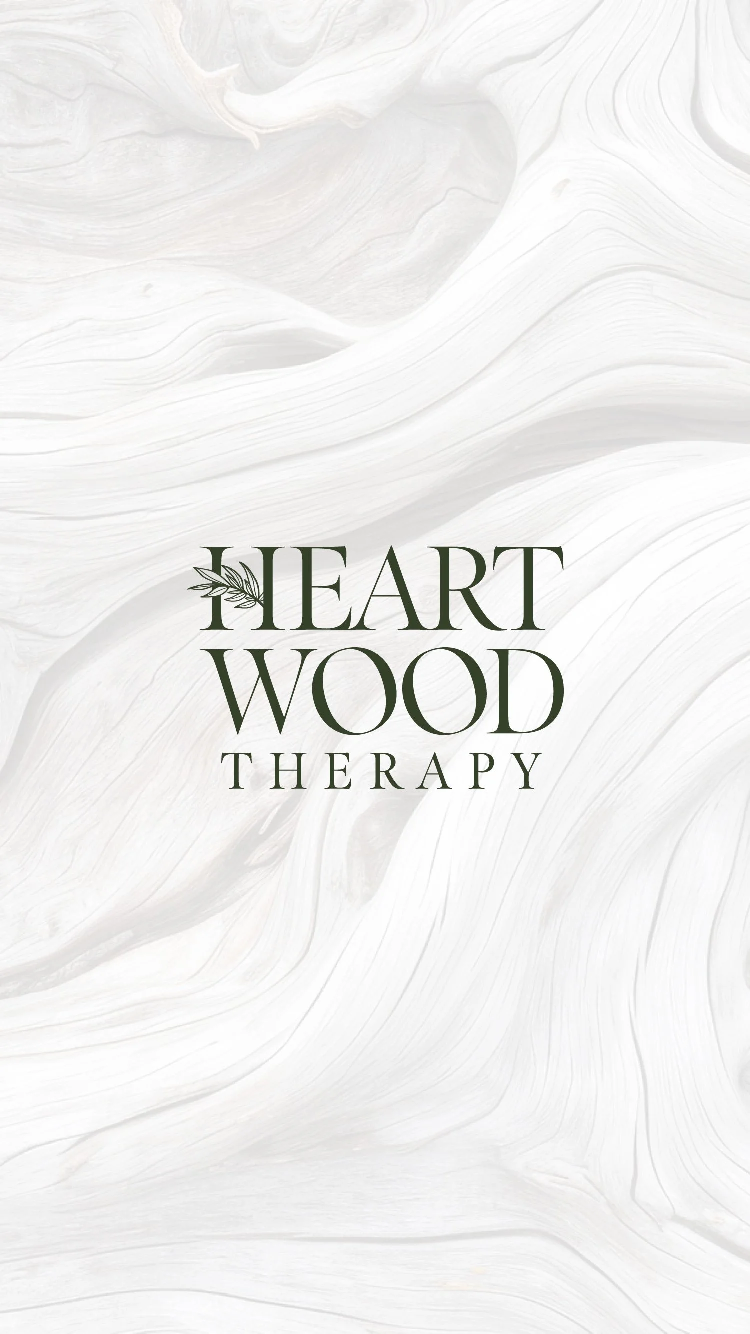 Logo design with the words 'Heart Wood Therapy' in green text and a small leaf design on the letter 'H'.