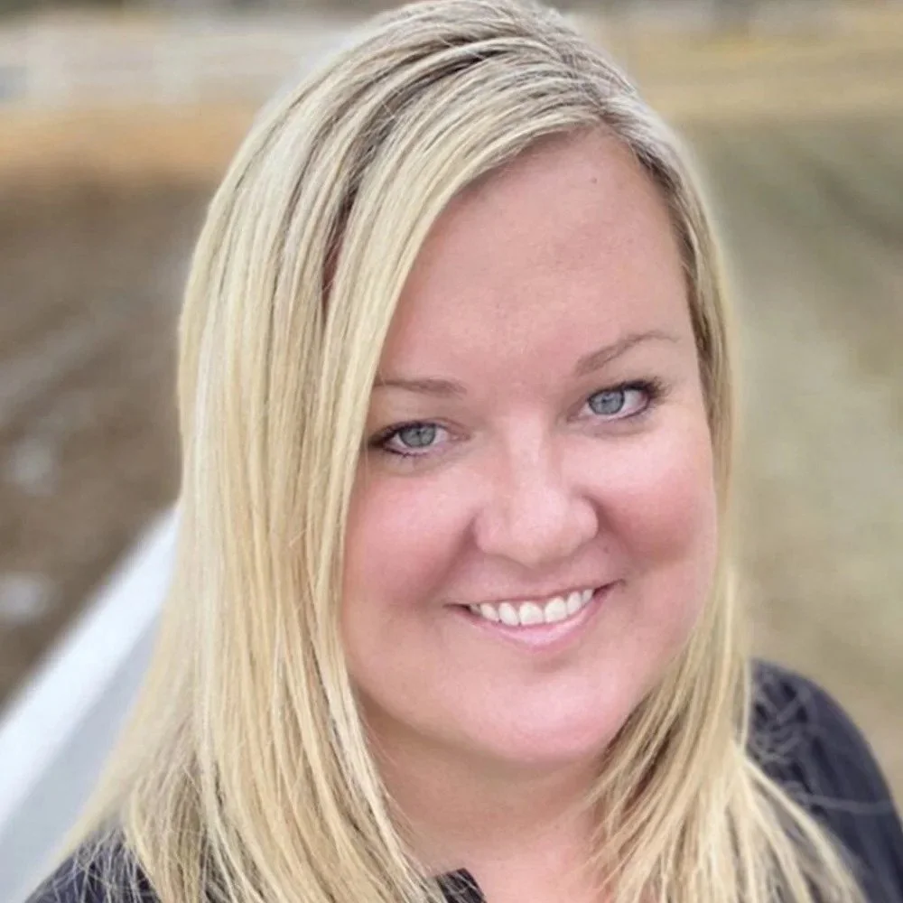 Courtney Murphy is a Six Leaf Design client and founder of EverBlush Beauty. She is a smiling woman with blonde hair and blue eyes outdoors.