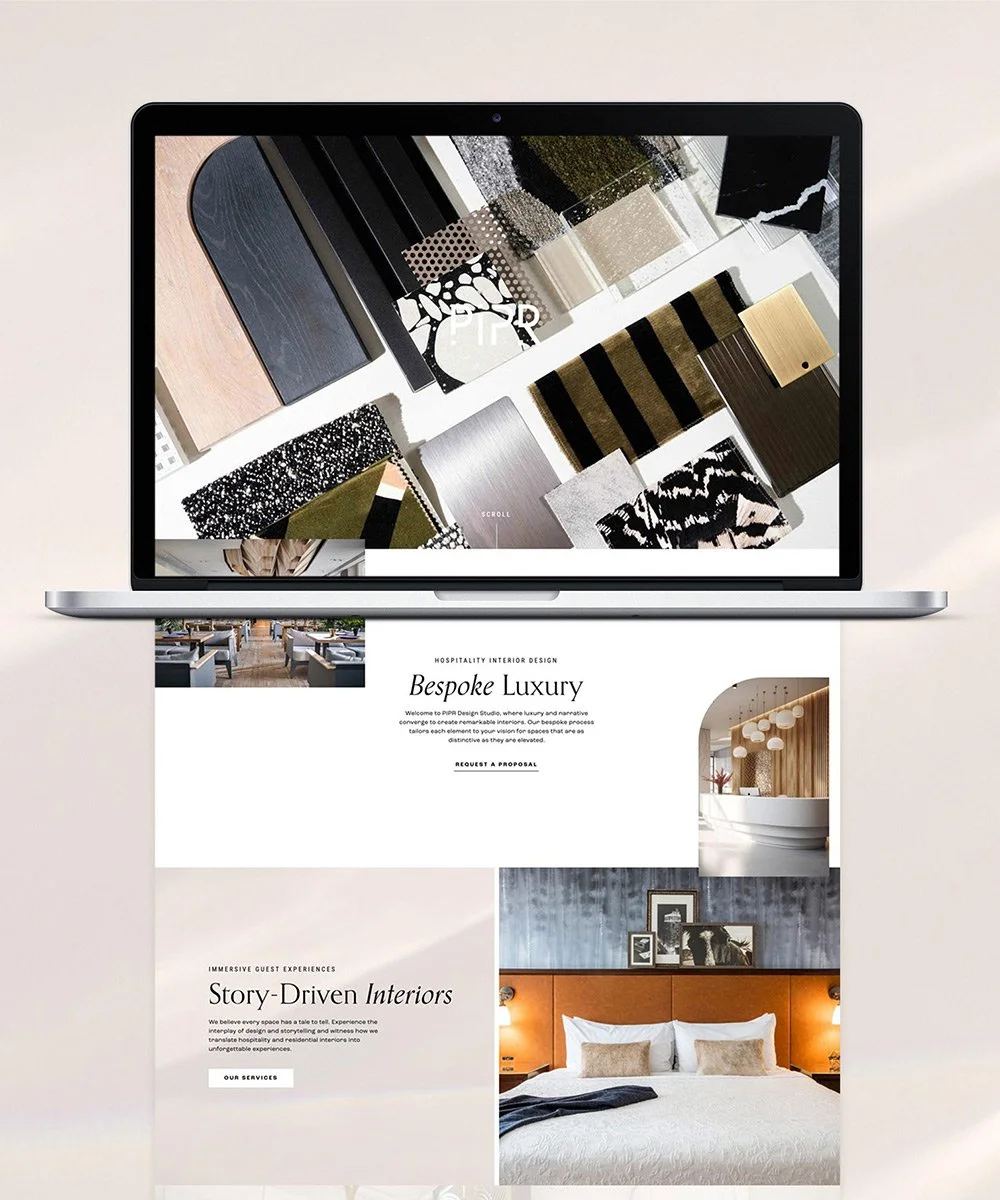 Open laptop displaying interior design samples and a website design for luxury interior design services.