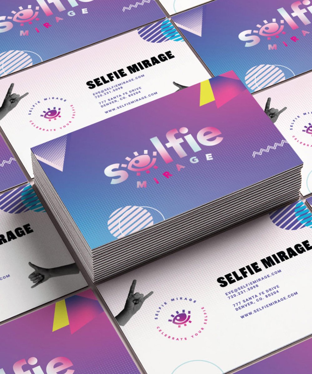 Stack of colorful business card designs for 'Selfie Mirage' with vibrant purple, pink, and yellow design, including the logo with a smiling eye, and contact information for a Denver-based mirror business.