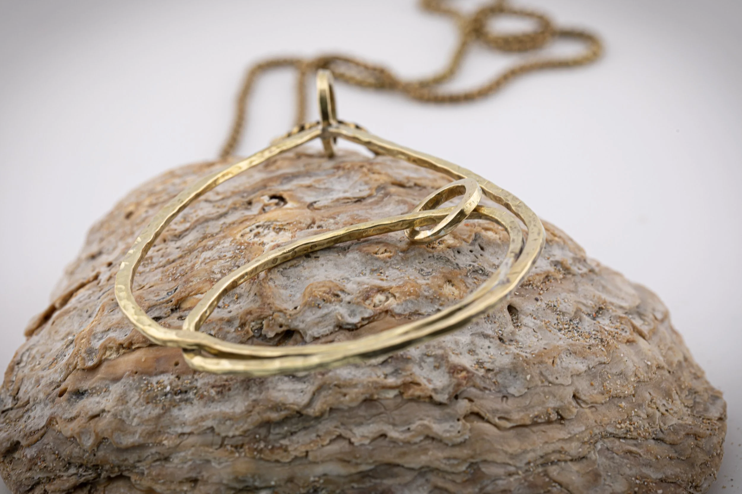 Brass freeform mother pendant.jpg