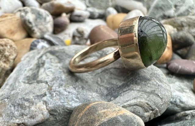 Chunky bezel set gold and green tourmaline ring.jpg
