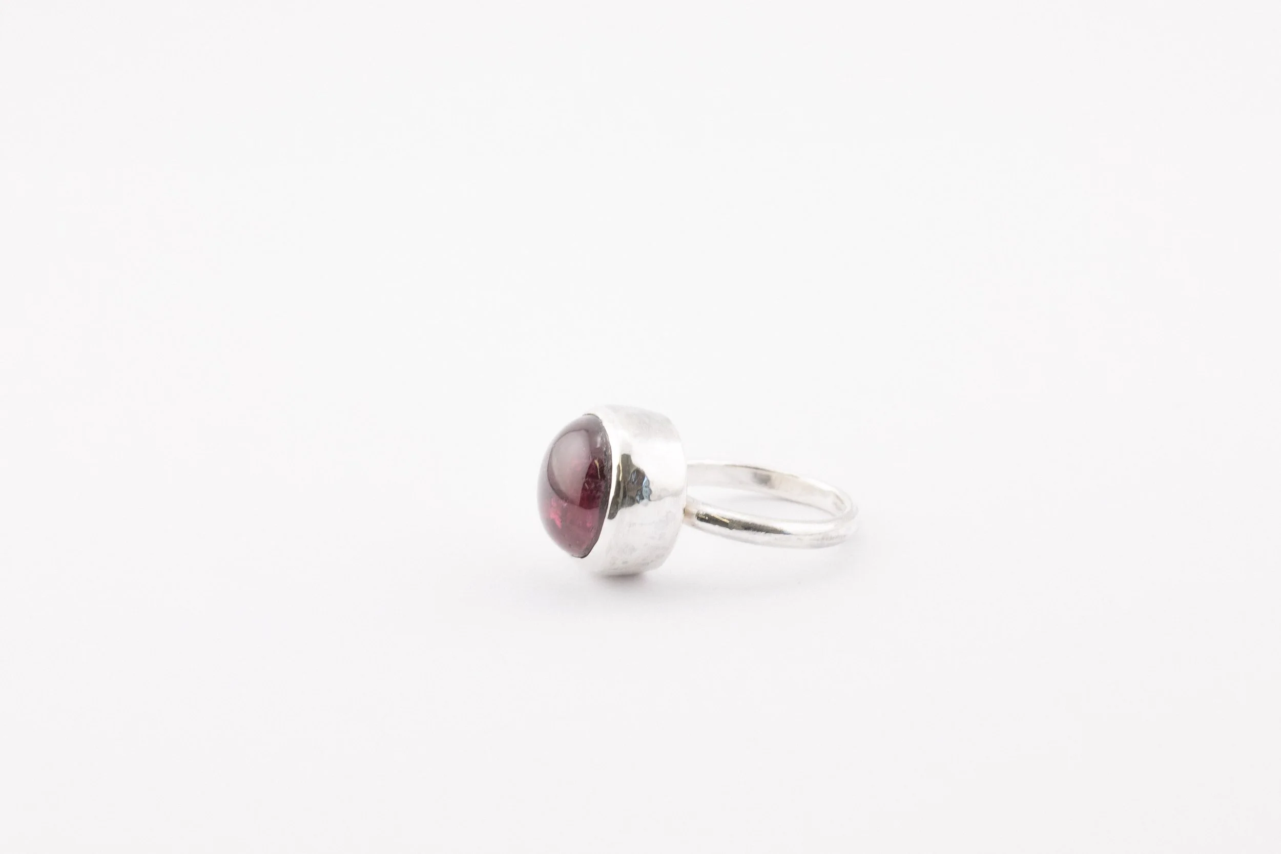Silver bezel set pink tourmaline cabochon ring.jpg