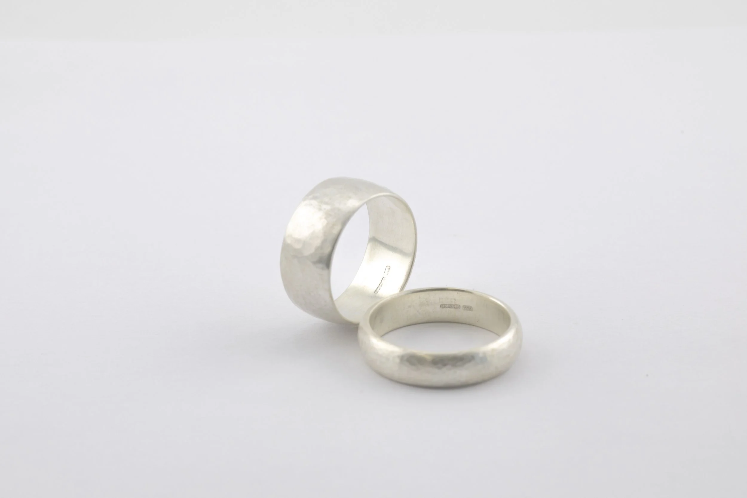 Silver wedding anniversary commission bands with hammered satin finish.jpg