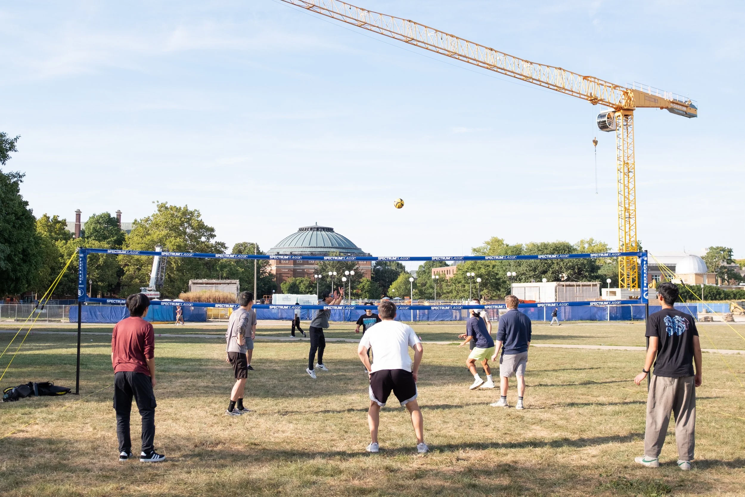 Playing volleyball at South Quad on UIUC campus with other UIUC students before Bible study.