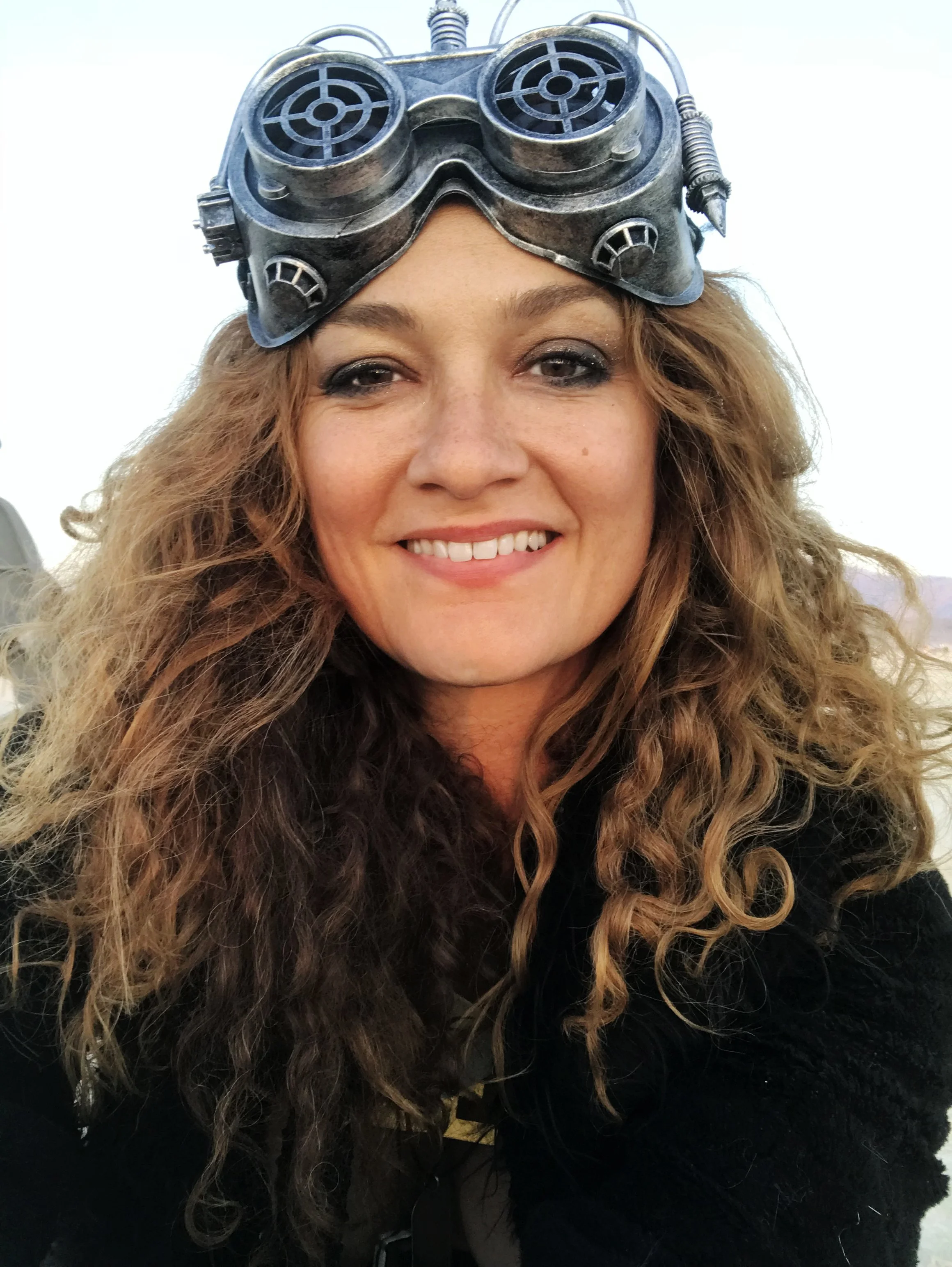 photo of artist kate raudenbush looking at the camera with goggles on