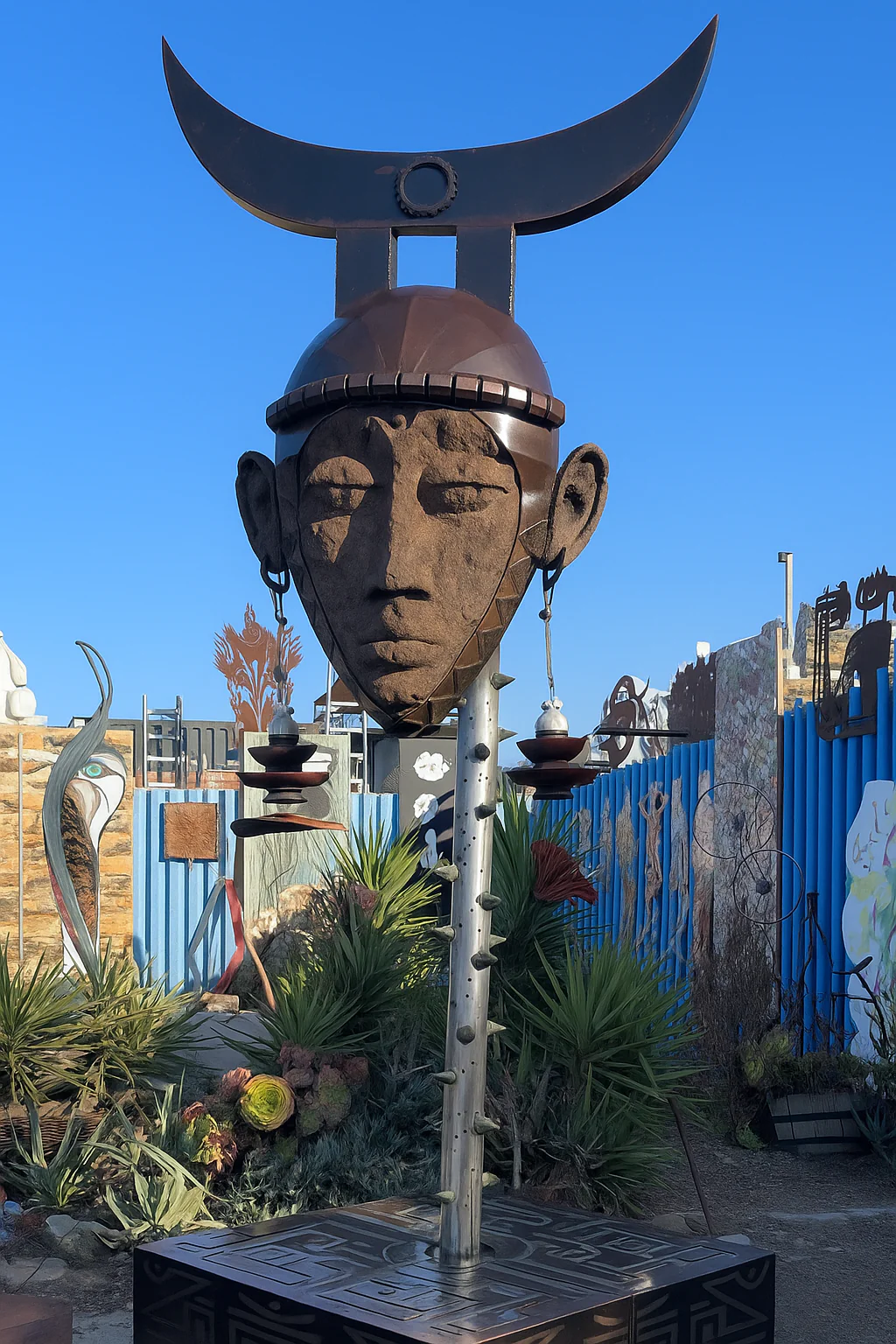 Giant mask sculpture made from industrial scrap turning heads at S.F. park