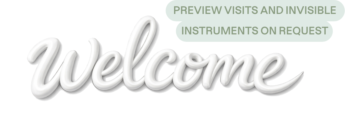 A sign with the word 'welcome' in script written with white toothpaste, accompanied by a speech bubble that reads 'PREVIEW VISITS AND INVISIBLE INSTRUMENTS ON REQUEST'.