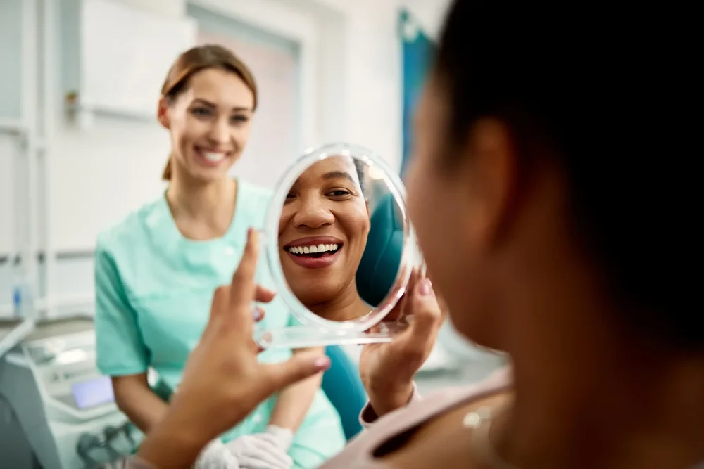 Patient smiling comfortably at Brush House