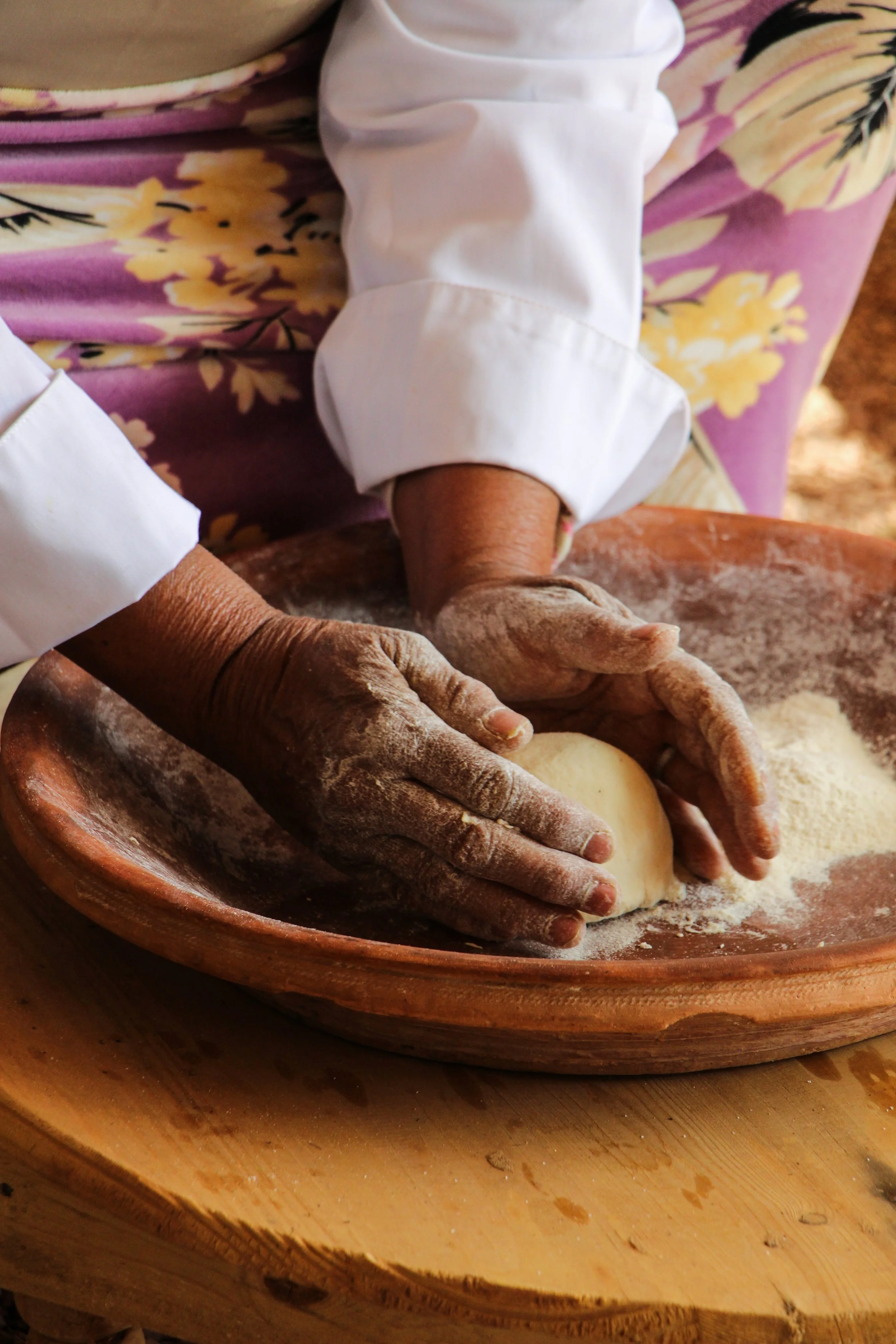 Woman preparing traditional Moroccan bread during a cooking class in Marrakech