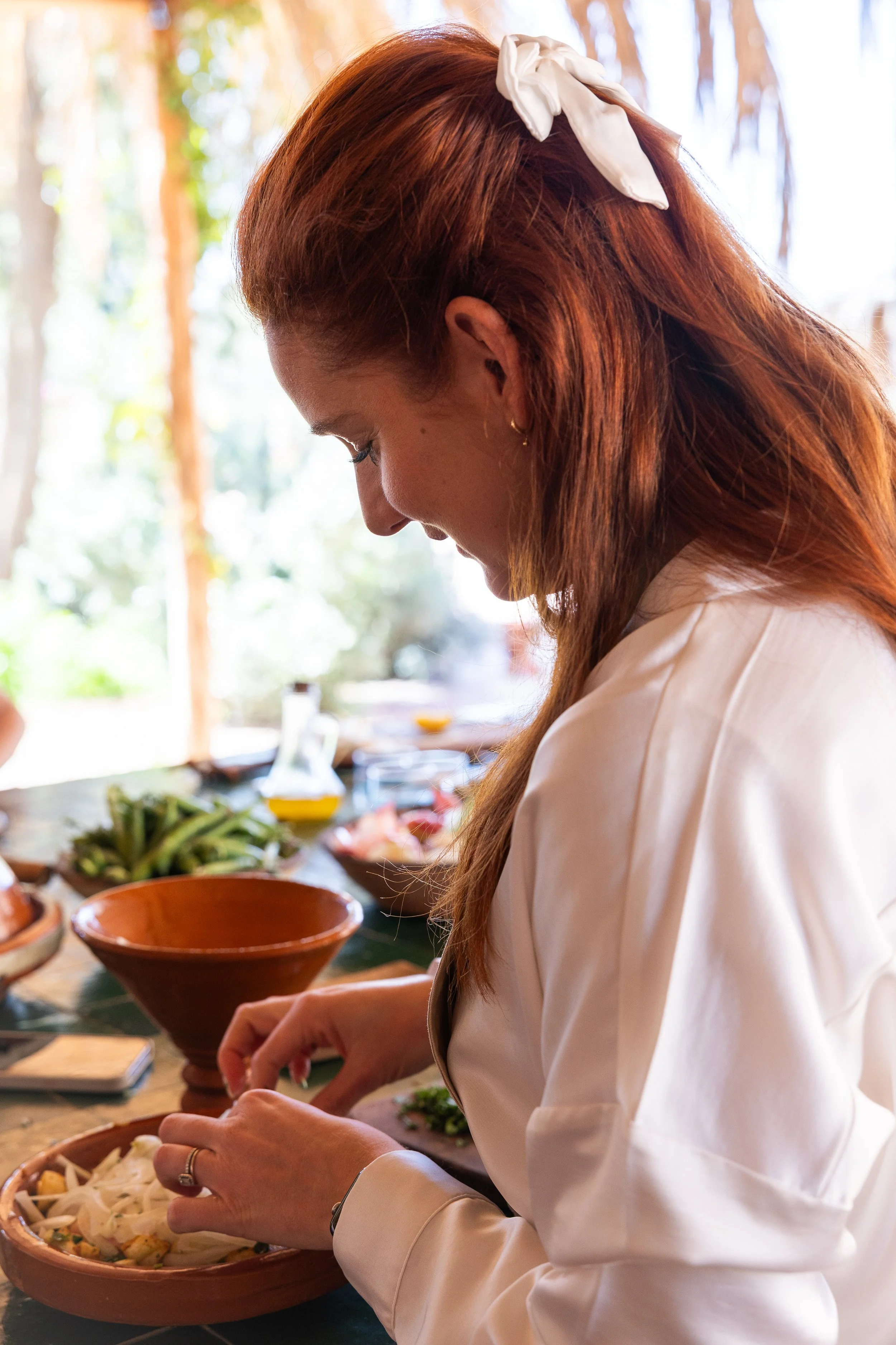 Guest participating in a hands-on Moroccan cooking class in Marrakech