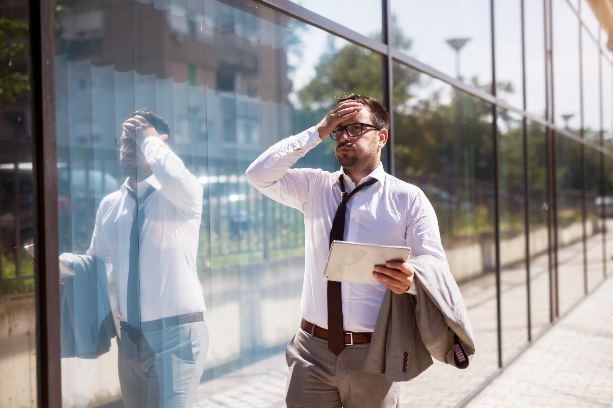 Man in a suit looking frustrated