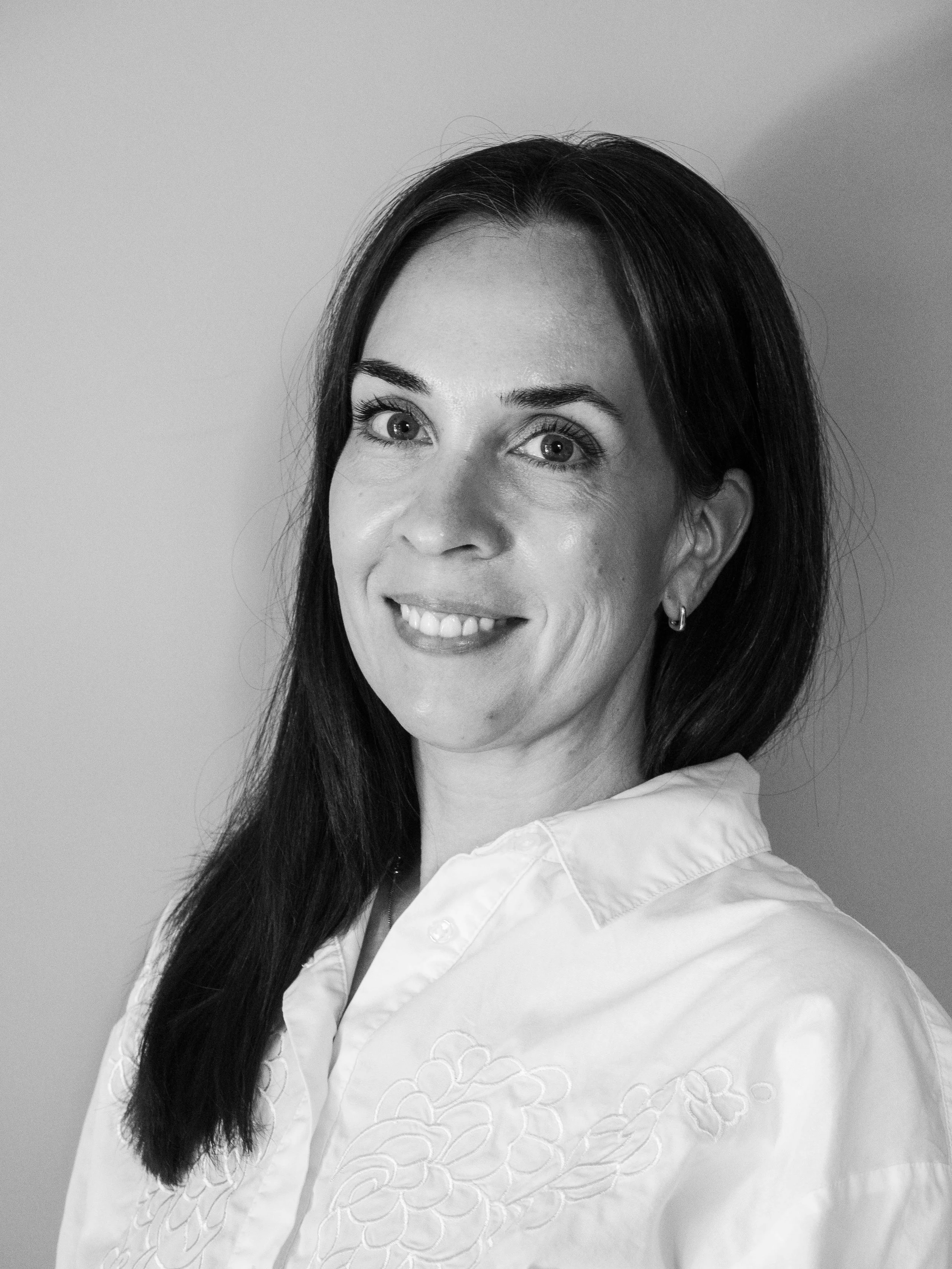 Black and white picture of a woman with dark hair.