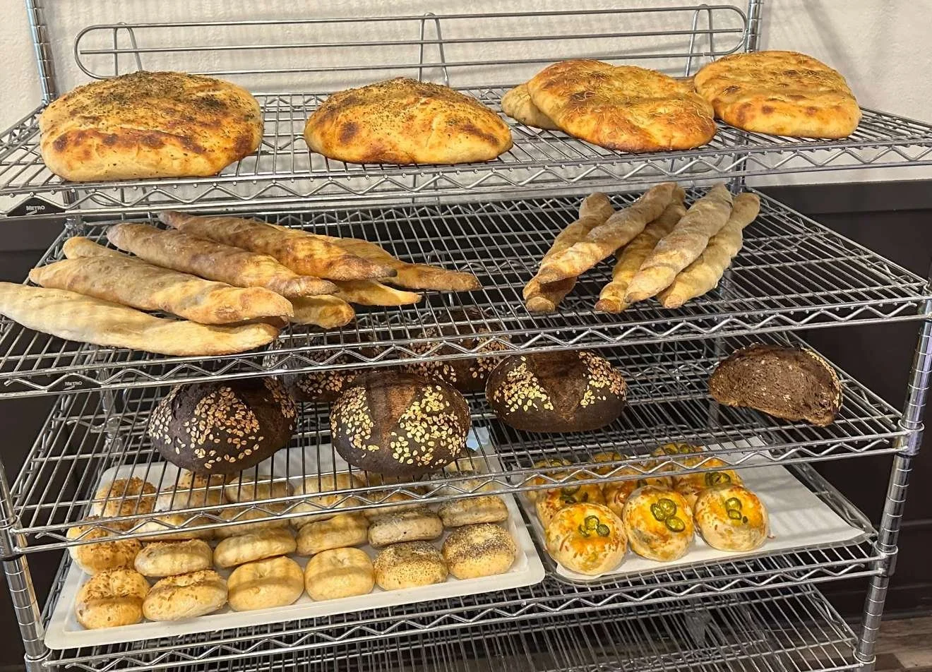 baxters-bakery-bread-stacked-on-metal-rack.PNG