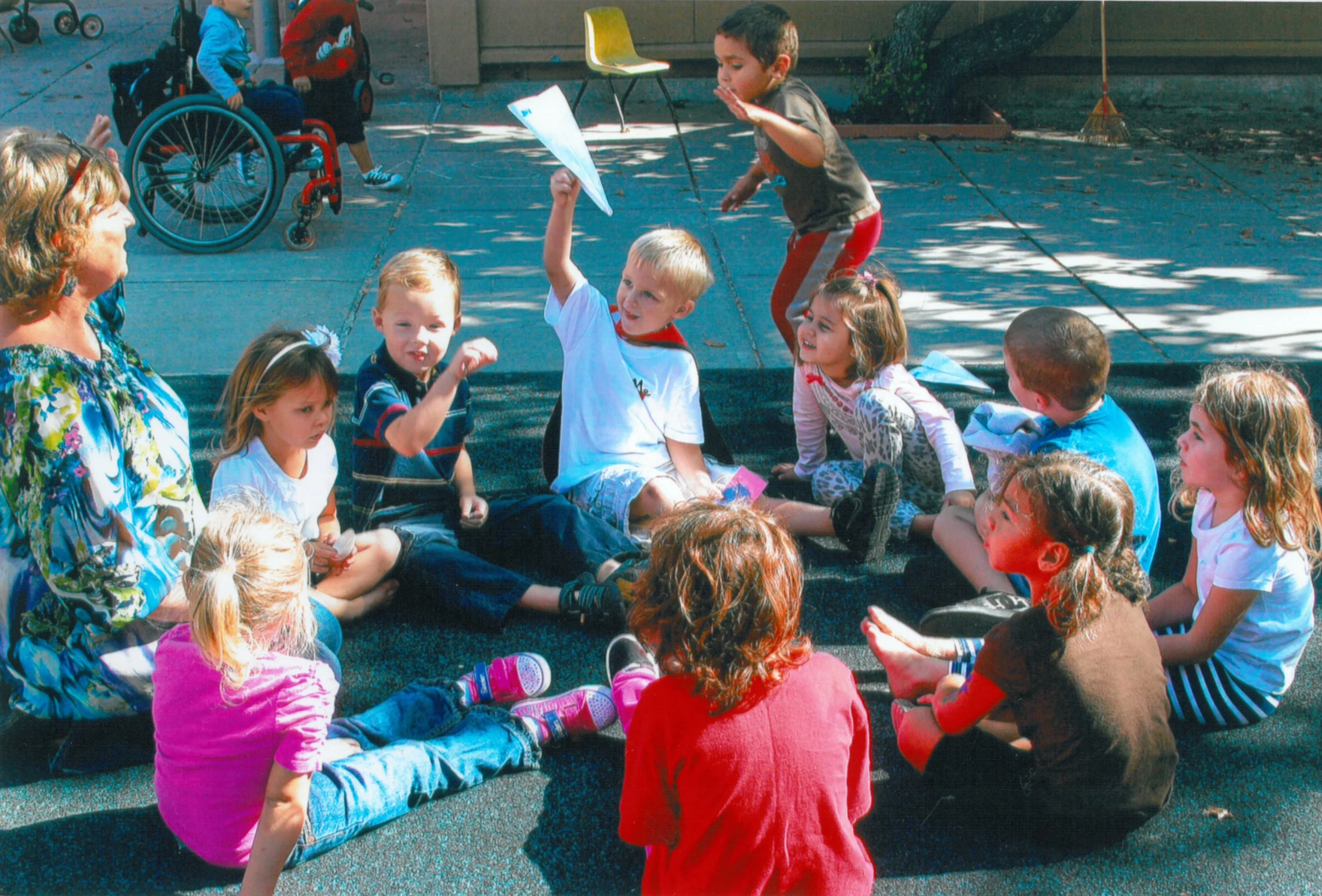MUSIC & MOVEMENT: Children gather together at the end of each morning for Circle Time, where they participate in songs, finger plays, and interactive games that get them moving. Music is woven into a variety of learning skills, such as counting, the 