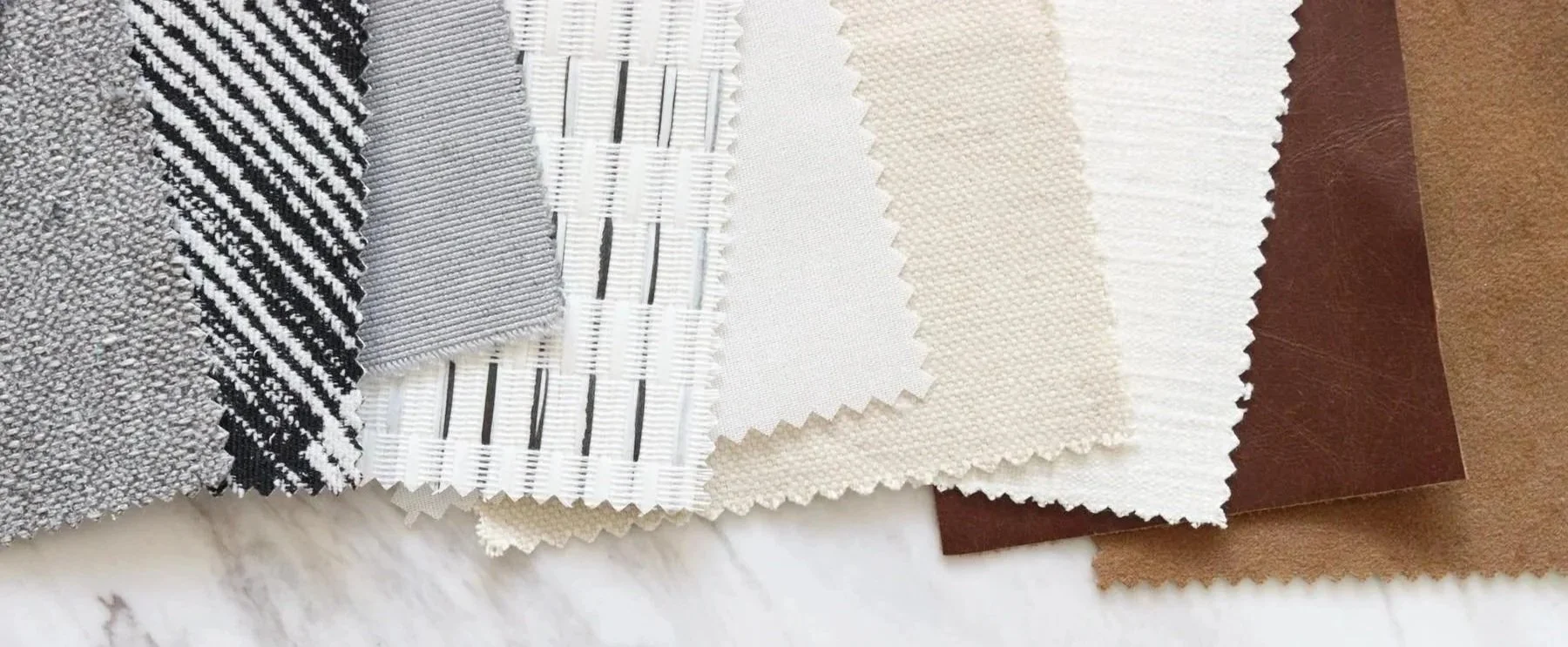 Sample fabric swatches in various textures and colors, including black, white, beige, and brown.