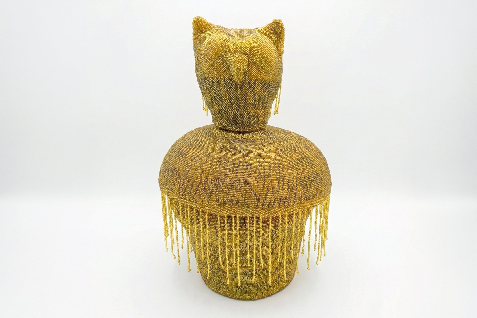 The Wise. 42 cm x 23 cm x 23 cm. Ceramic hand made pieces, hand made beaded lining. 2026.