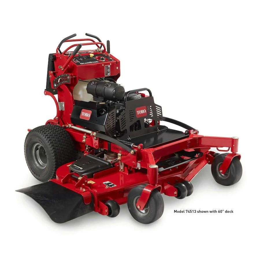 A Toro commercial zero-turn lawn mower with a 60-inch deck, painted red, with black components and large rear tires.