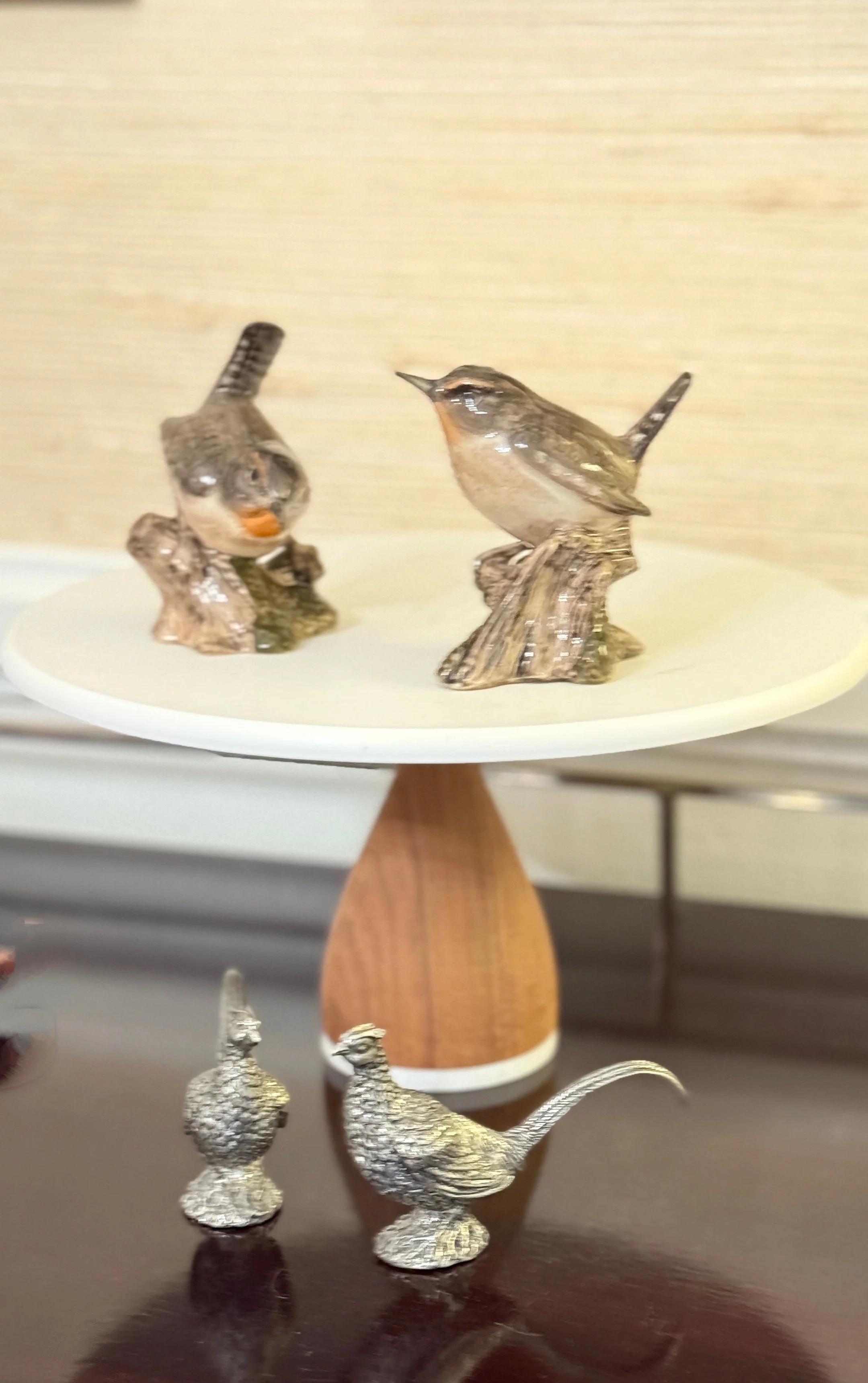 Decor of beautiful birds on a pedestal