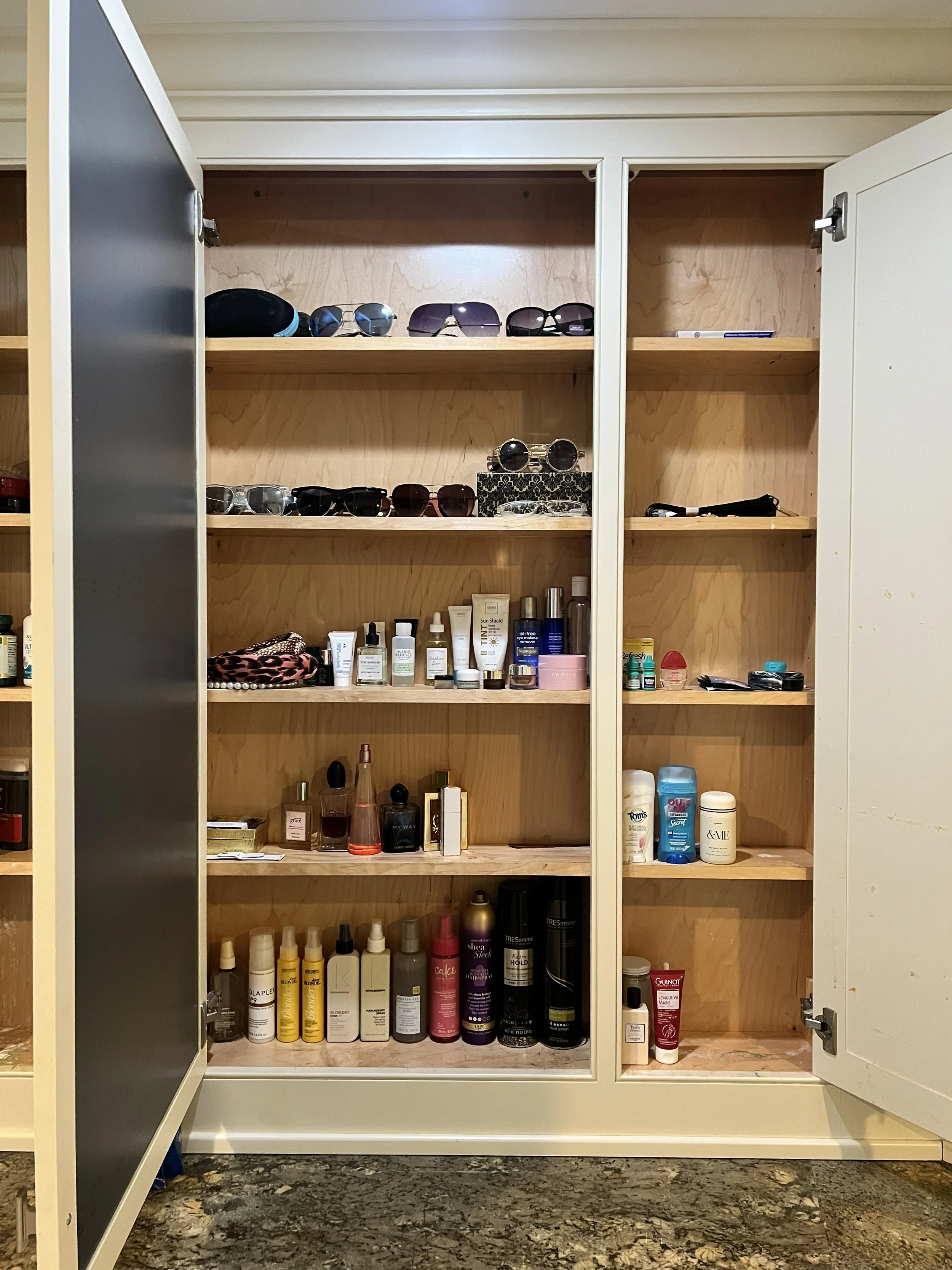Luxury bathroom medicine cabinet featuring adjustable shelving, and elegant storage solutions in a beautifully renovated bathroom.