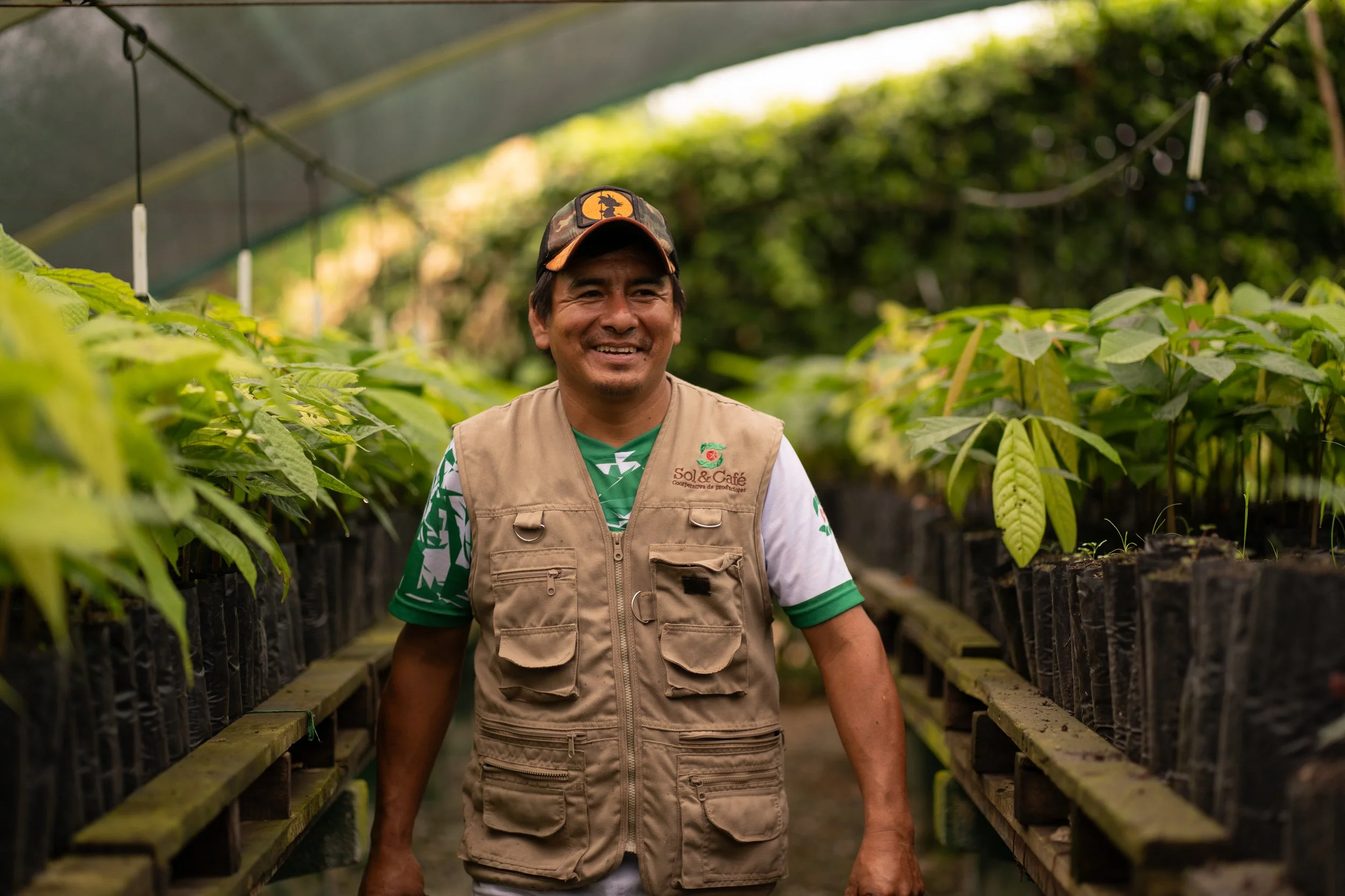 Víctor William Torres Estela, agricultural technician, walks through the plant nursery of the Sol y Café cooperative in Peru