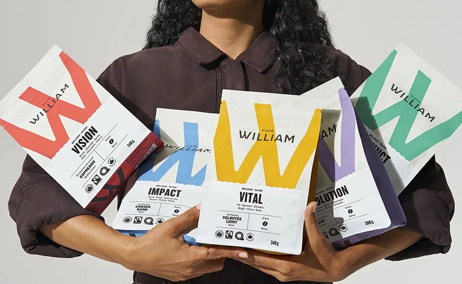 Person holding bags of Café William coffee
