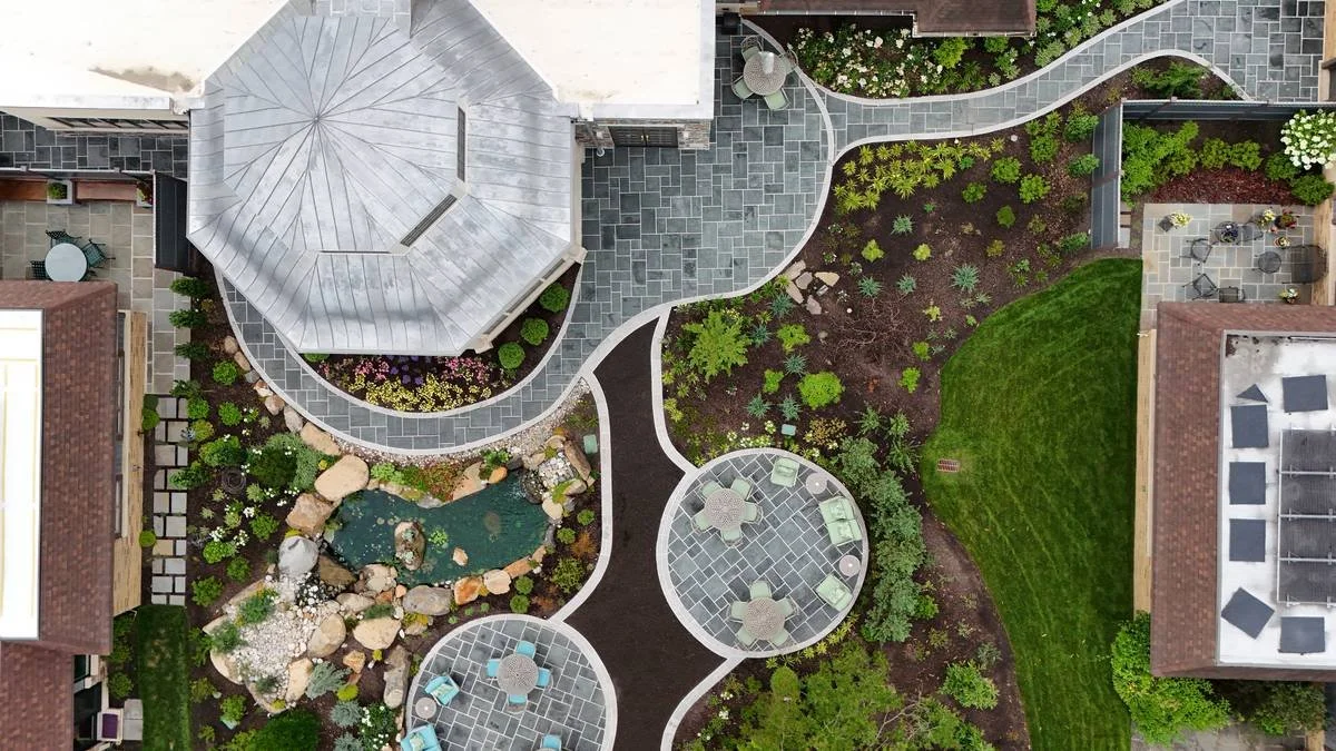 Aerial view of a courtyard garden with bluestone paths, patios and ponds — Brandywine Designs