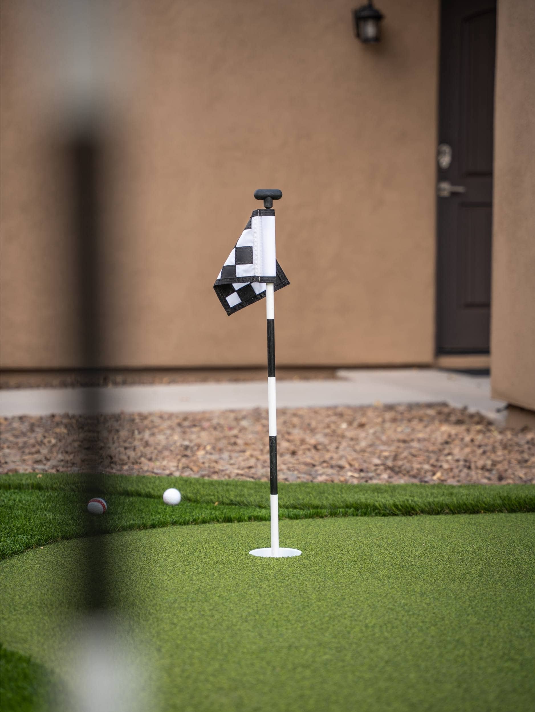 A putting greens installation in Chandler, AZ showing precise turf layout and practice space