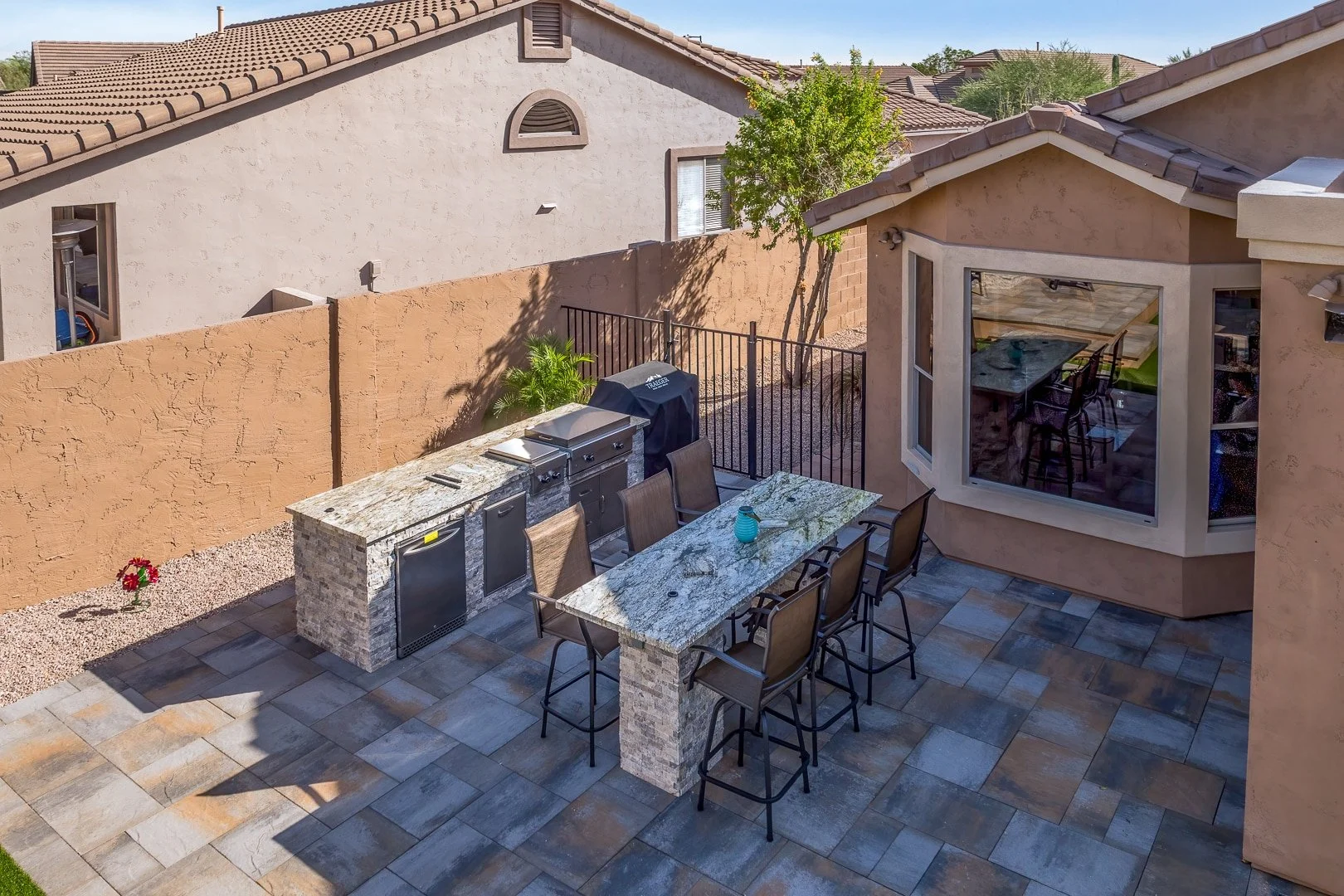 outdoor kitchen layout featuring a built-in grill and prep space in Avondale, AZ