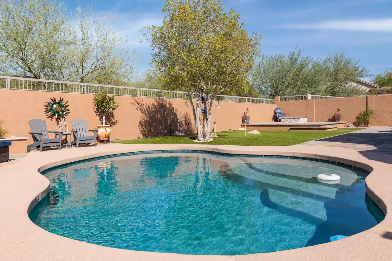 Backyard layout with artificial turf and stepping path in Queen Creek, AZ
