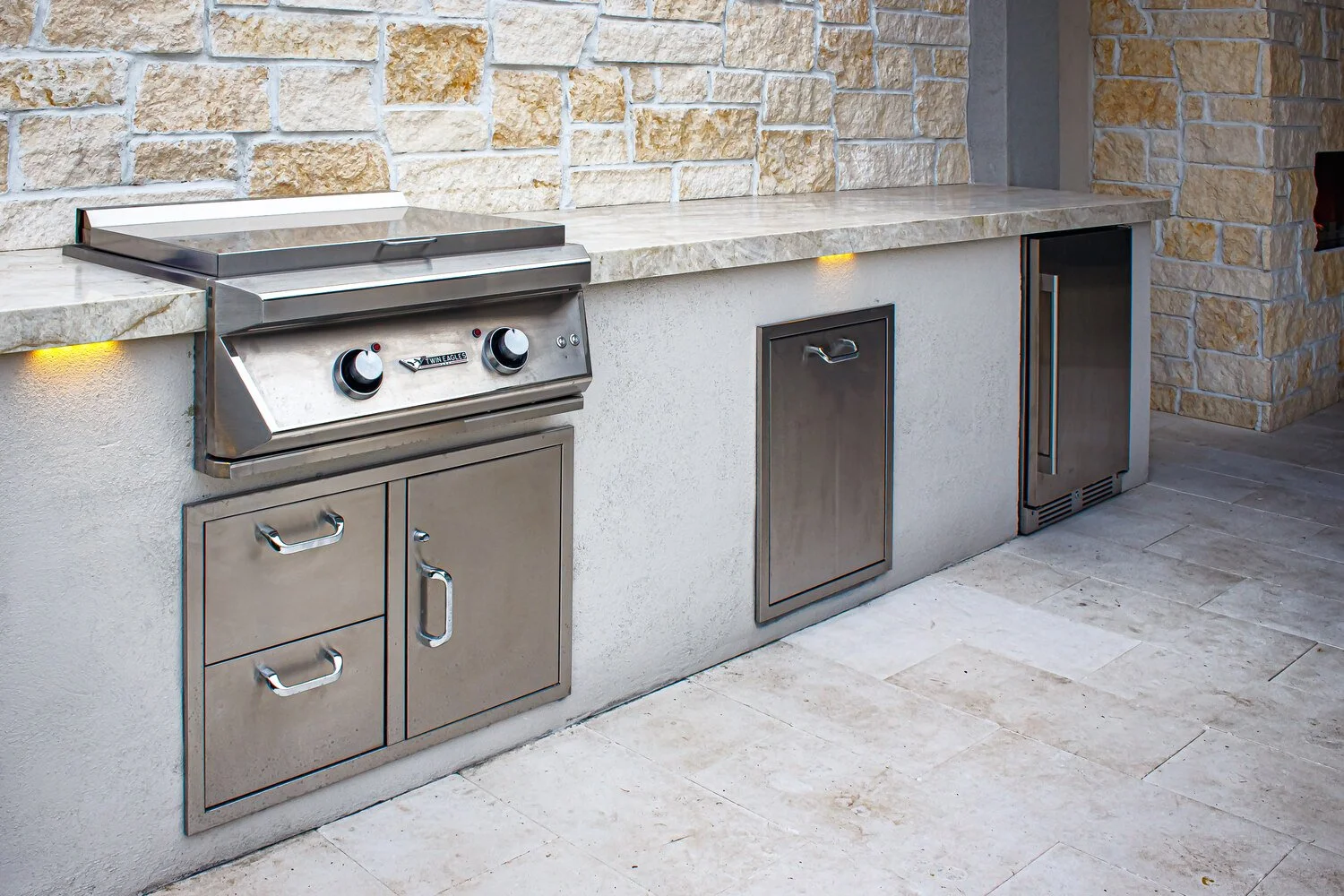 outdoor kitchen with built-in appliances and shaded counter area in Glendale, AZ