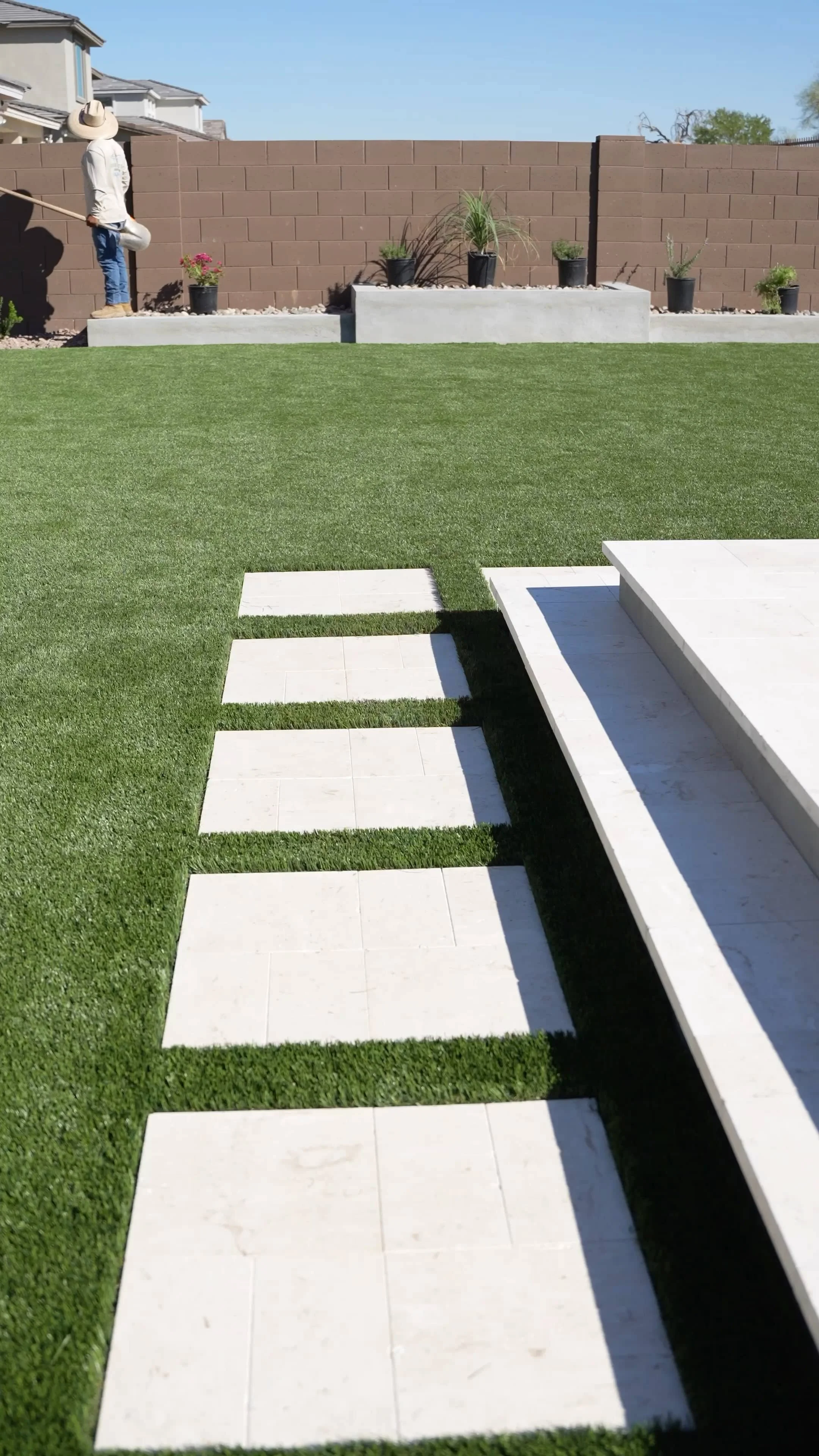Stepping pads set in artificial turf in Chandler, AZ as part of a clean landscape design