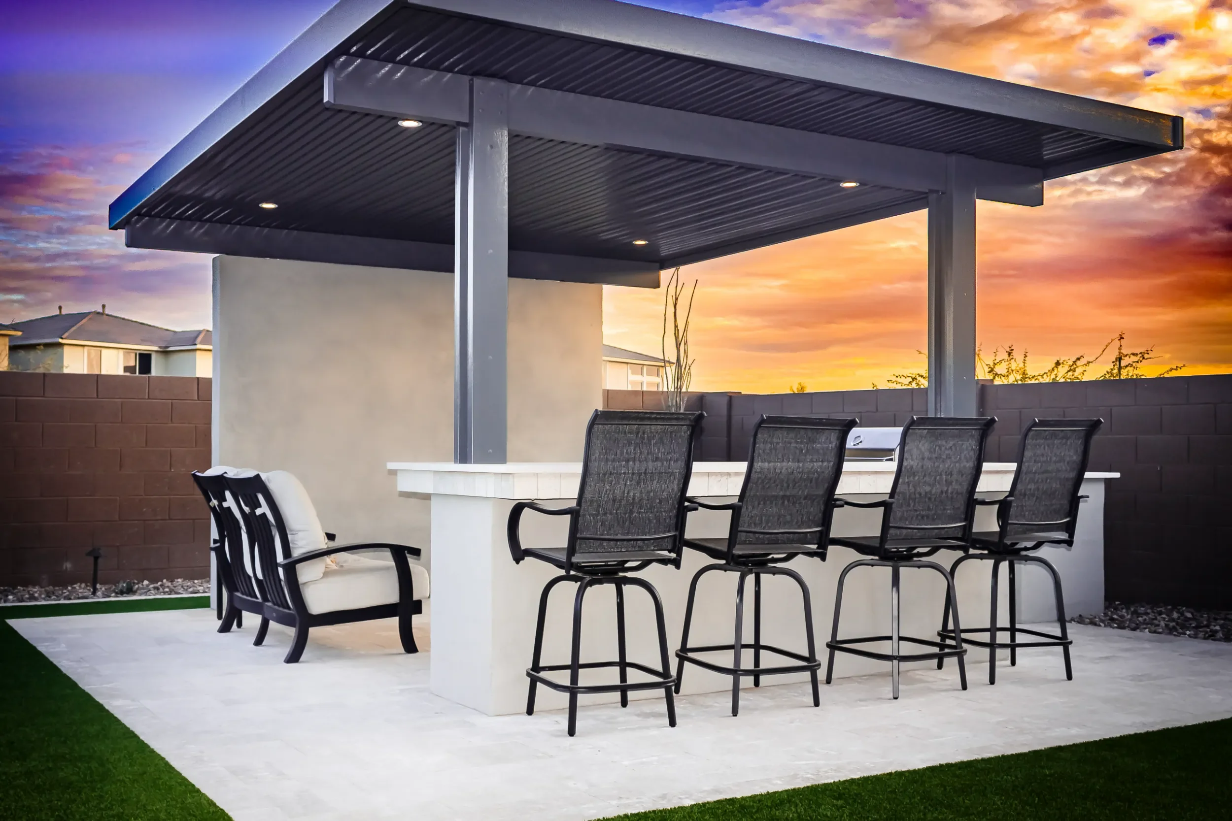 Modern paver patio and seating area created through landscape design in Queen Creek, AZ