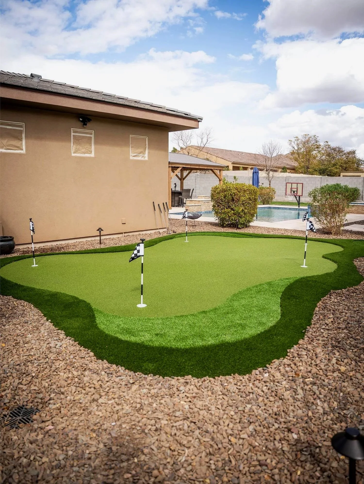Backyard practice area with putting green in Surprise, AZ