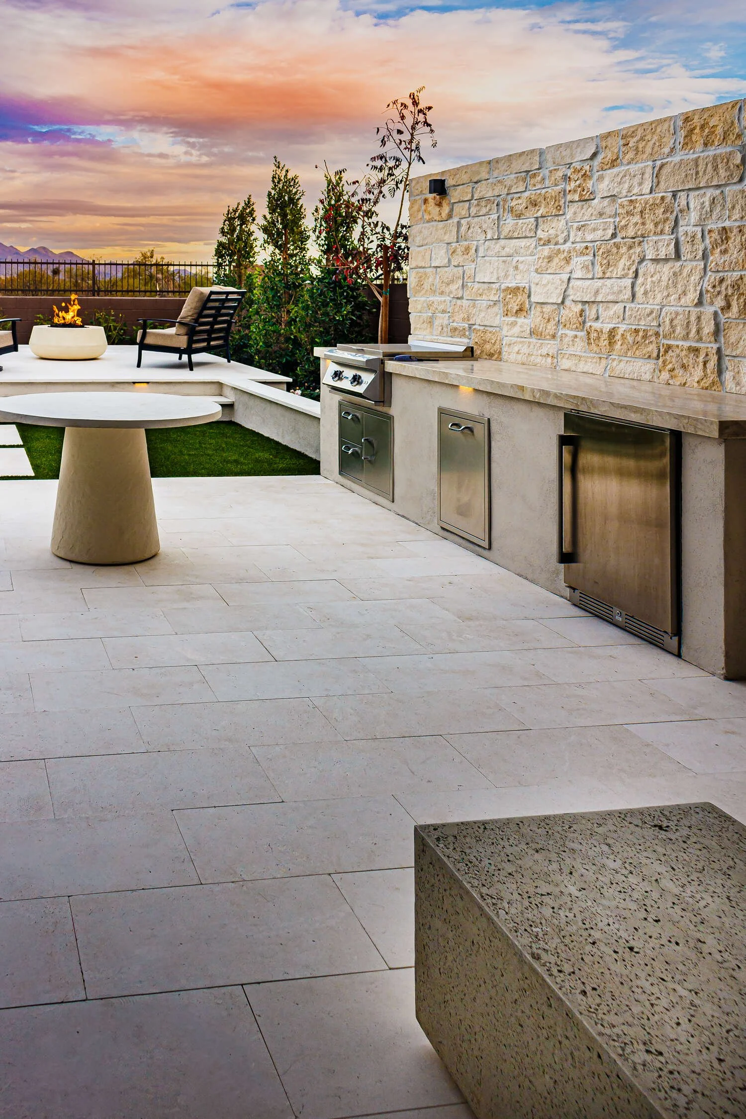 Scottsdale, AZ landscape design team installing materials with care on a backyard project