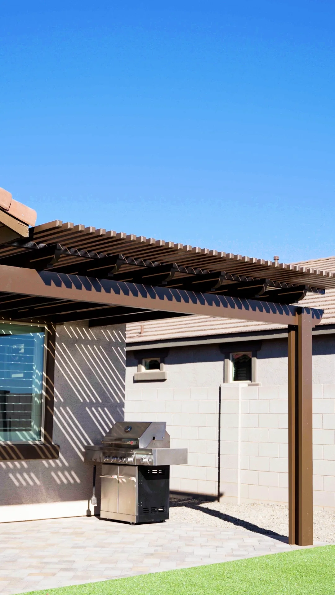 Outdoor kitchen under pergola in Scottsdale, AZ
