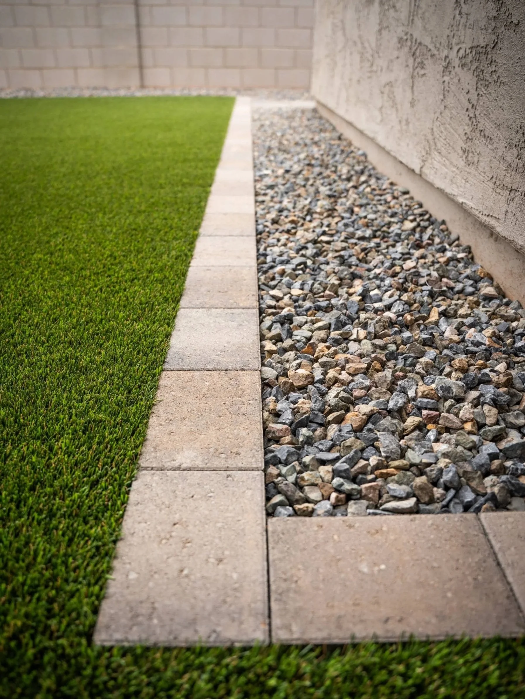 synthetic grass with curved edge detail and modern tile in Queen Creek, AZ