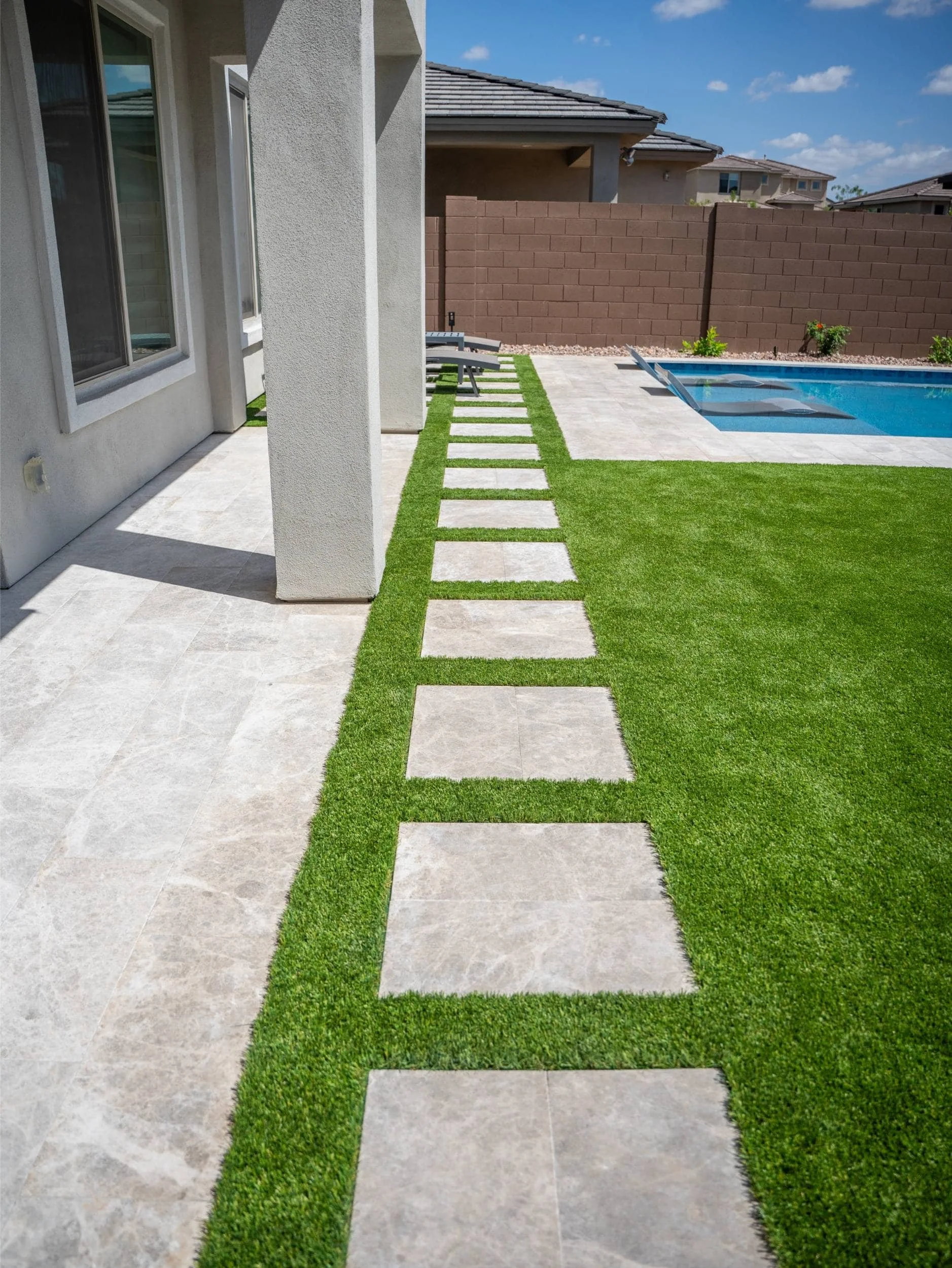 A garden walkway in Paradise Valley, AZ with artificial turf and geometric pads