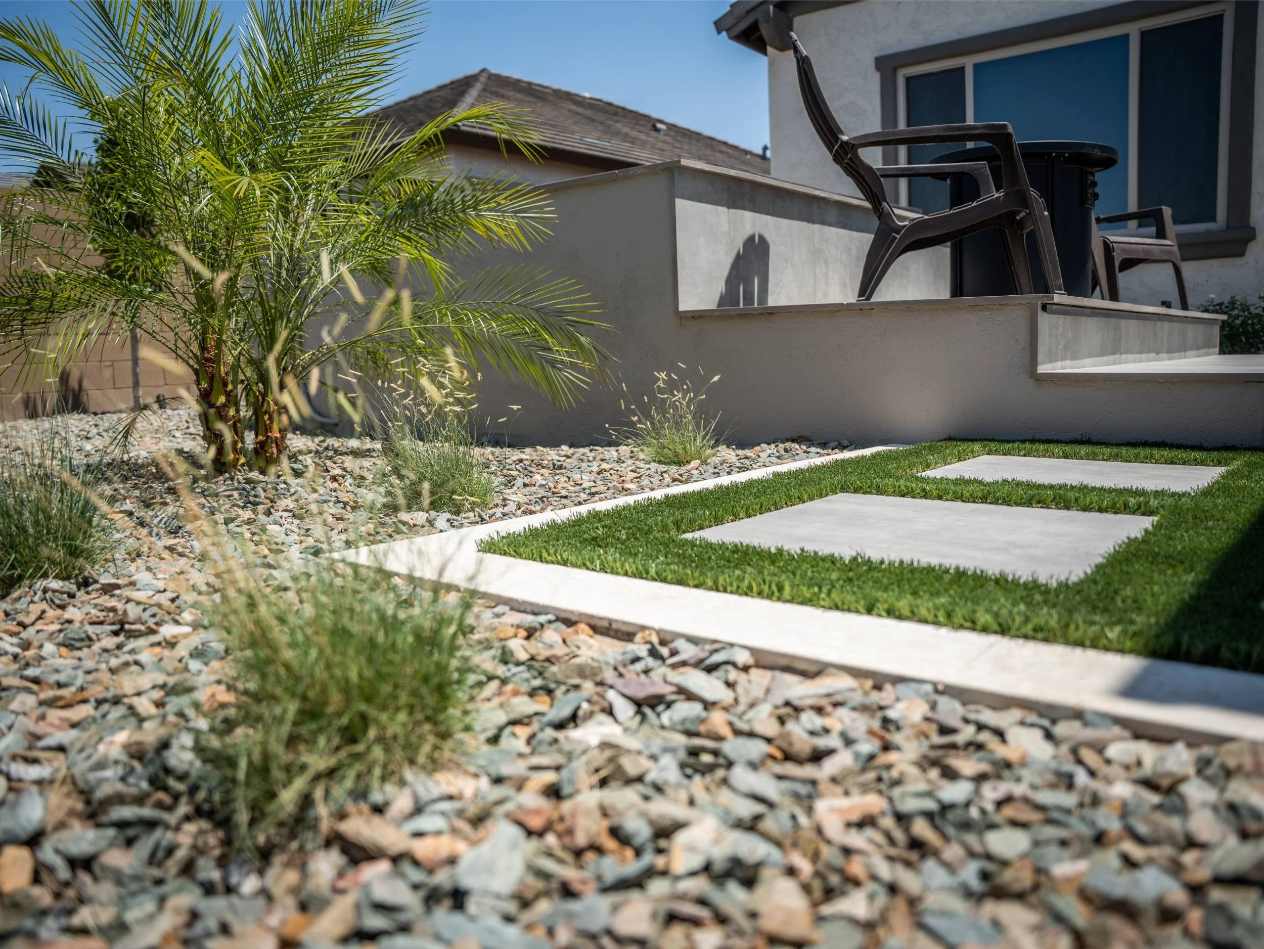 low-maintenance artificial turf around pool and patio in Gilbert, AZ